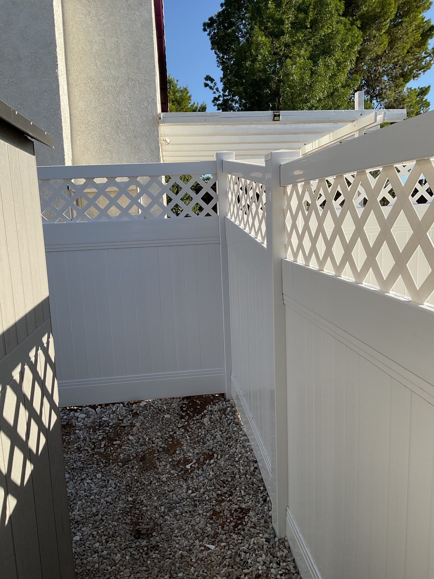 Lattice Vinyl with Privacy Vinyl Fence by Fence Guys Inc.