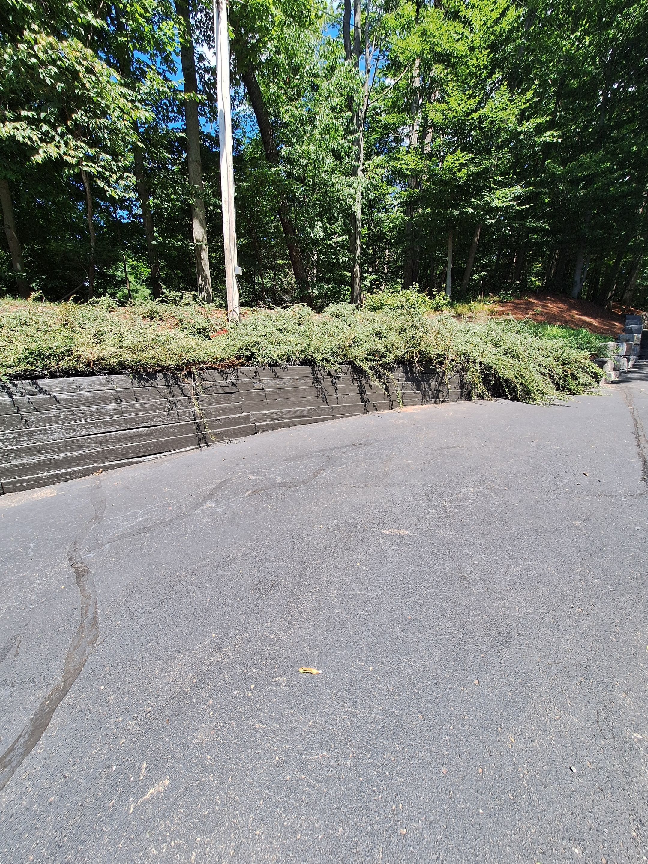 Exterior Retaining Wall Painting | Grand Haven, Michigan by Gordon Painting