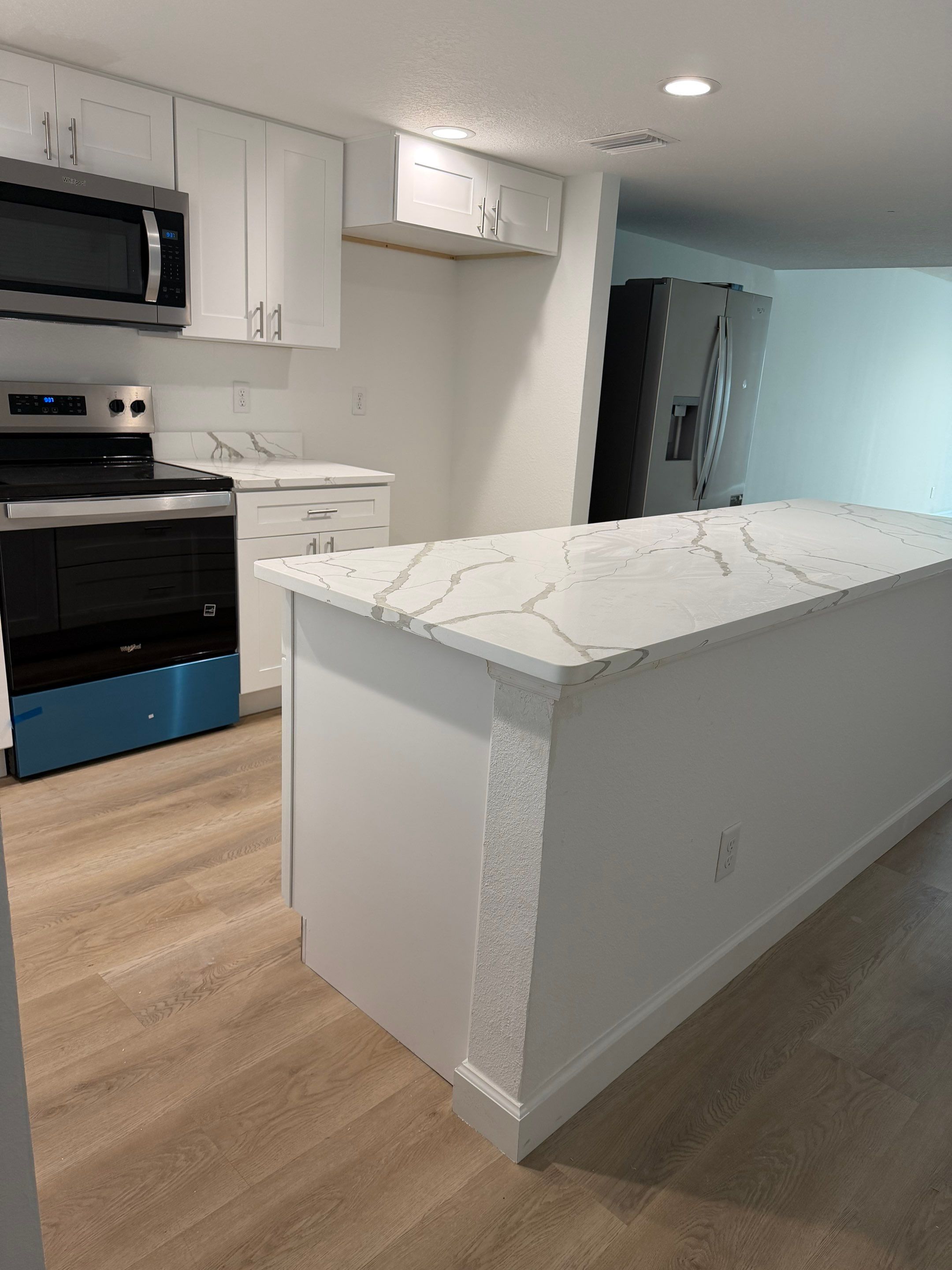 Full Condominium Remodel Featuring Aubrey Oak Flooring In Daytona Beach by Acies Renovations