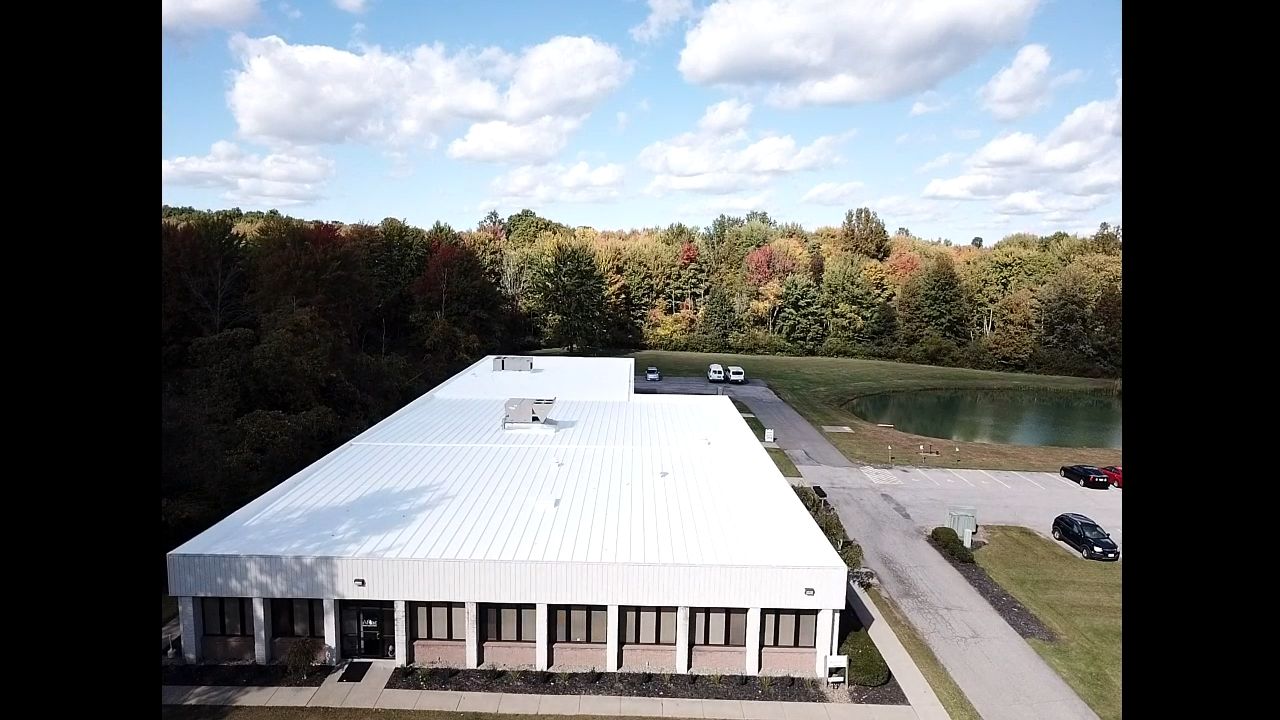 Commercial Metal Roof Coating by Gold Star Roofing LLC