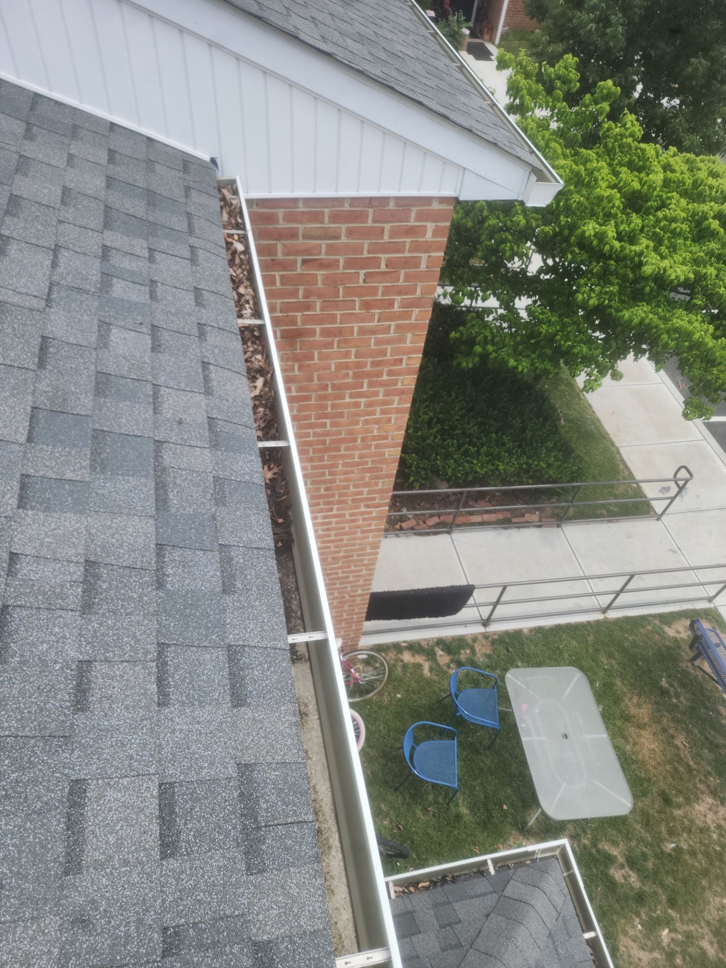 HOA gutter cleaning in Pinehurst & Southern Pines, NC,before photo showing full gutters.