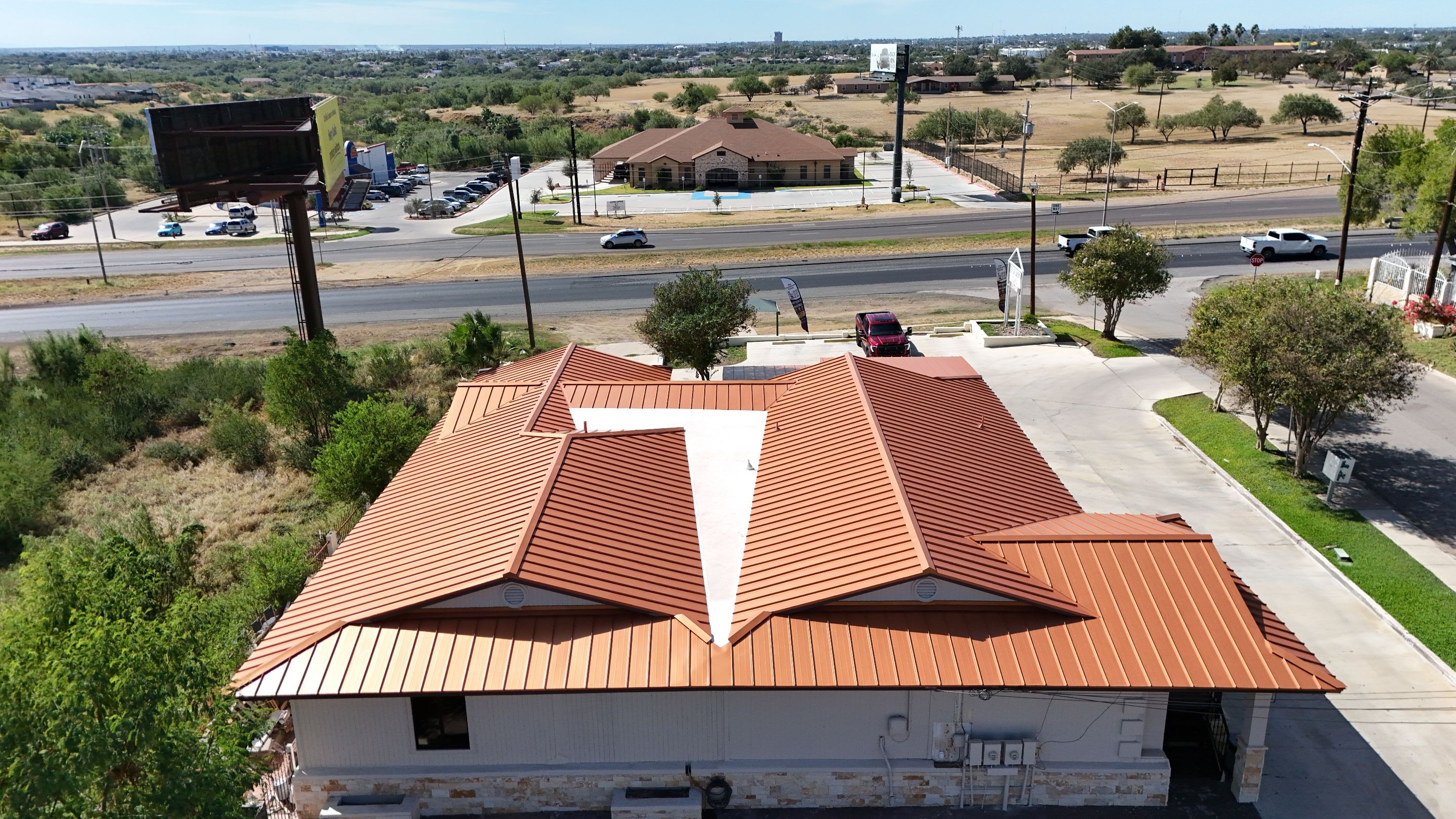 Copper Standing Seam Metal Roof Installation for Laredo Medical Clinic by JM Flores Roofing & Construction, Inc