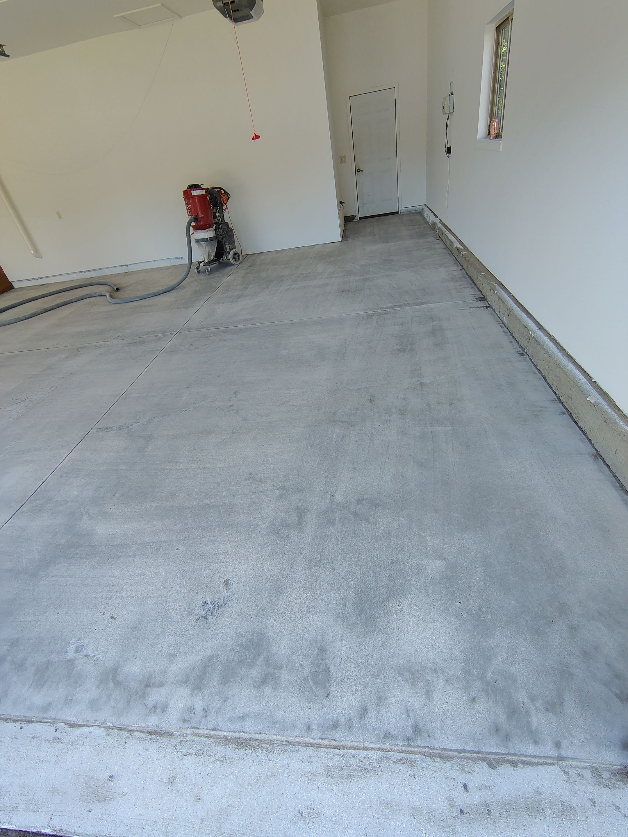 Custom Grey Speckled Epoxy Floor Coating for Sioux Falls Garage by Select Painting, Coatings & Garage Cabinets