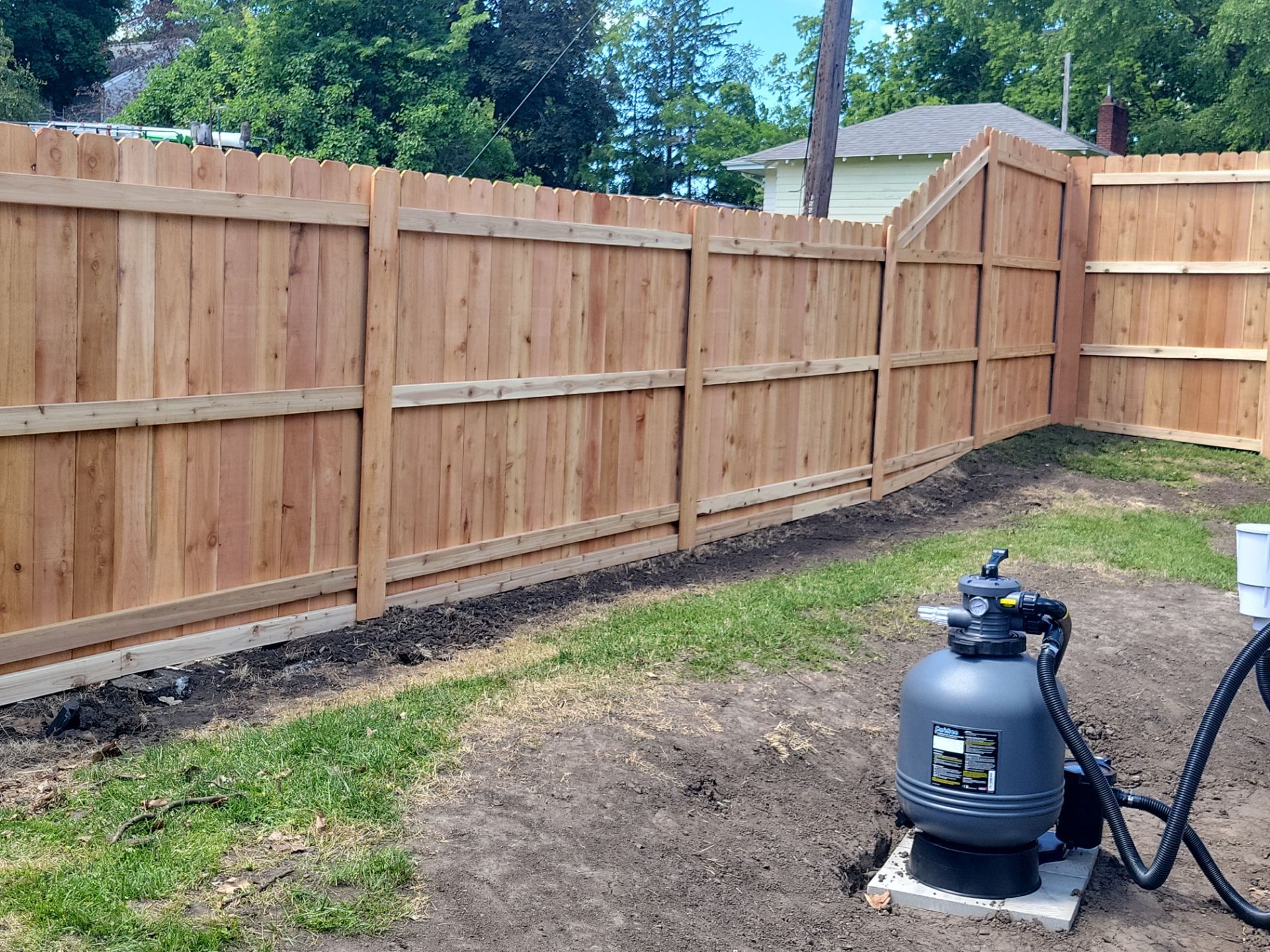 Custom Cedar Unstained Wood Privacy Fence Installation in Cedar Falls by Perfect Picket Fence and Stain