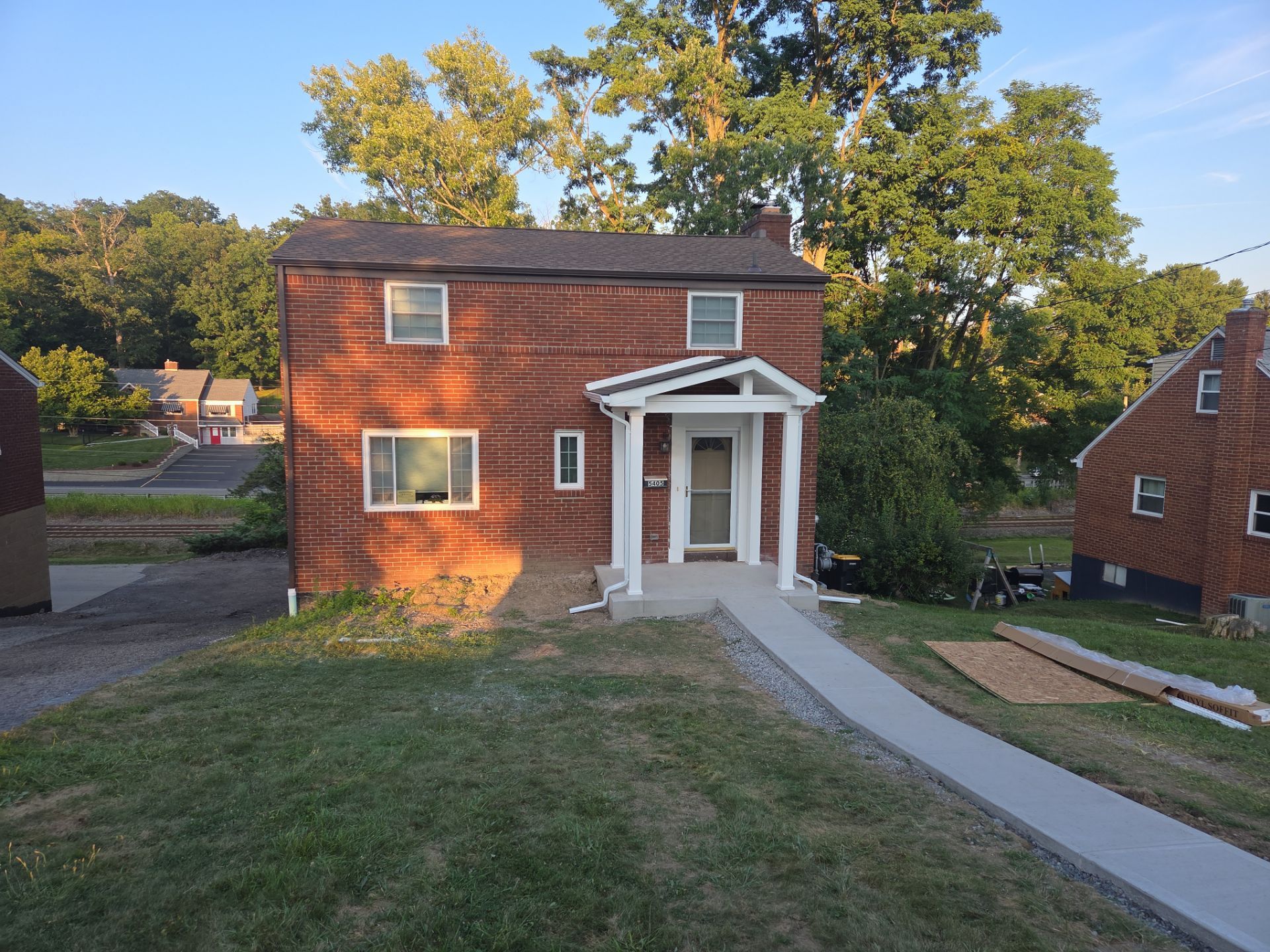 Concret and roof build  by Cousins Roofing Siding & Decks