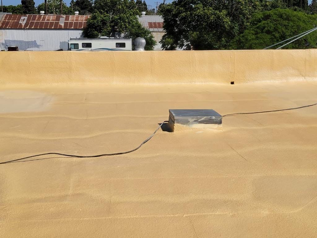 Spray foam and coatings using Conklin Benchmark/PUMA XL coatings and spray foam by Straight Edge Roofing Inc