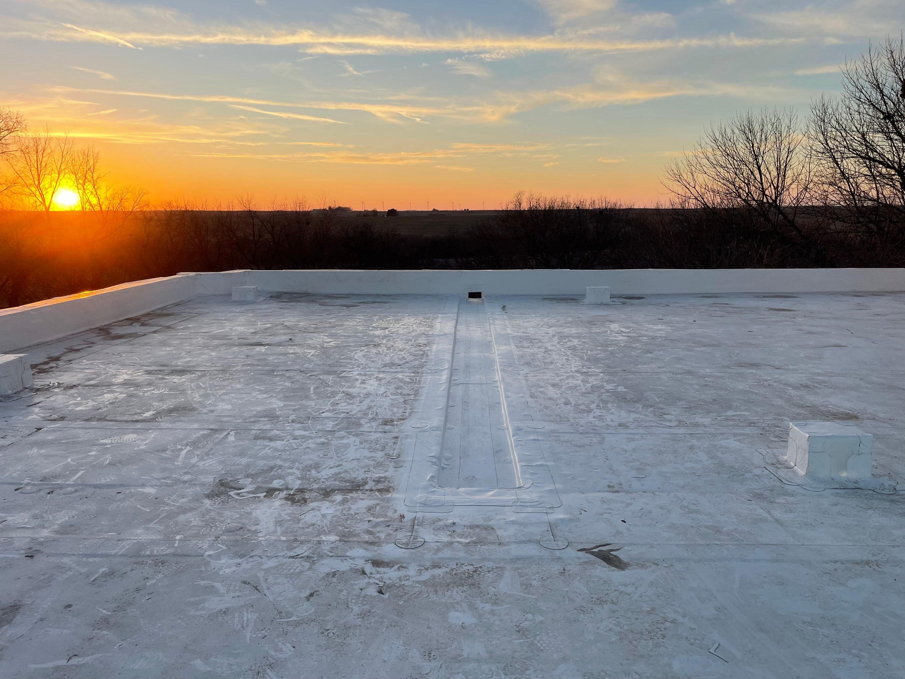 Commercial Flat Roof IB PVC Install  by Titan Commercial & Residential Roofing 