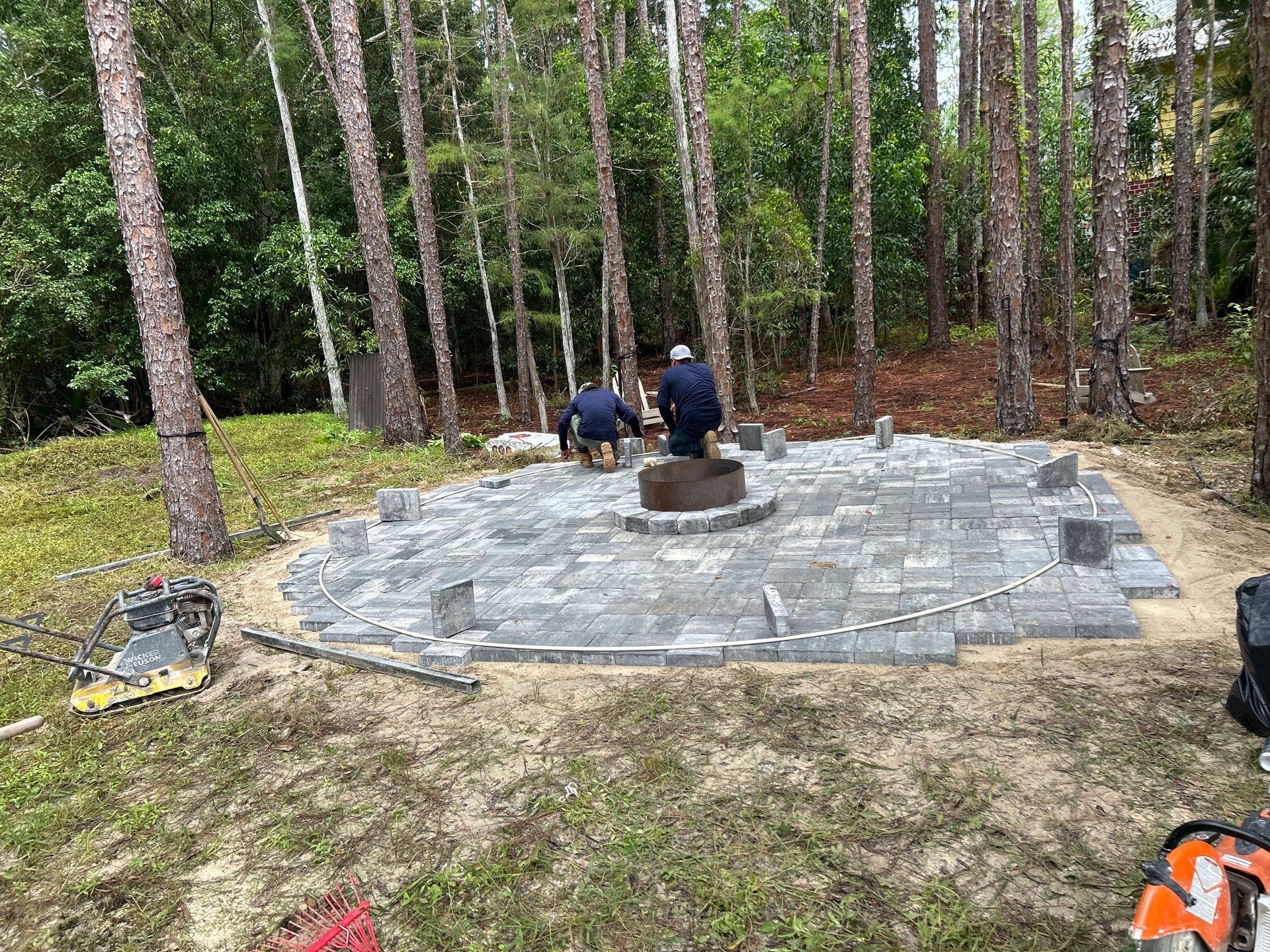 Fire pit and seating area/Oaks Blvd Naples by Old Town Pavers Llc