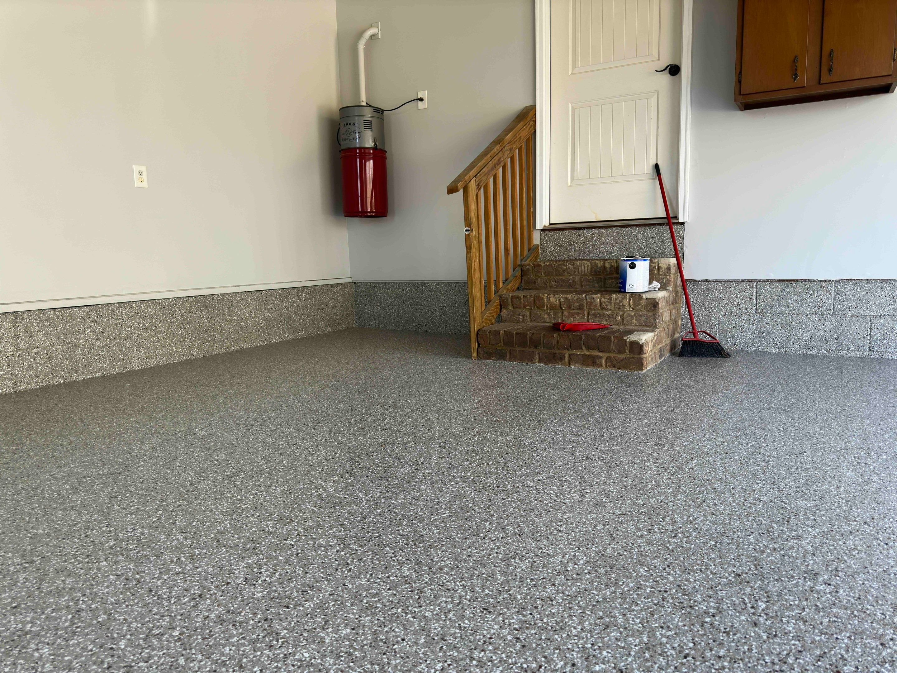 Front Porch and Garage using Creekbed by Elite Floor Solutions