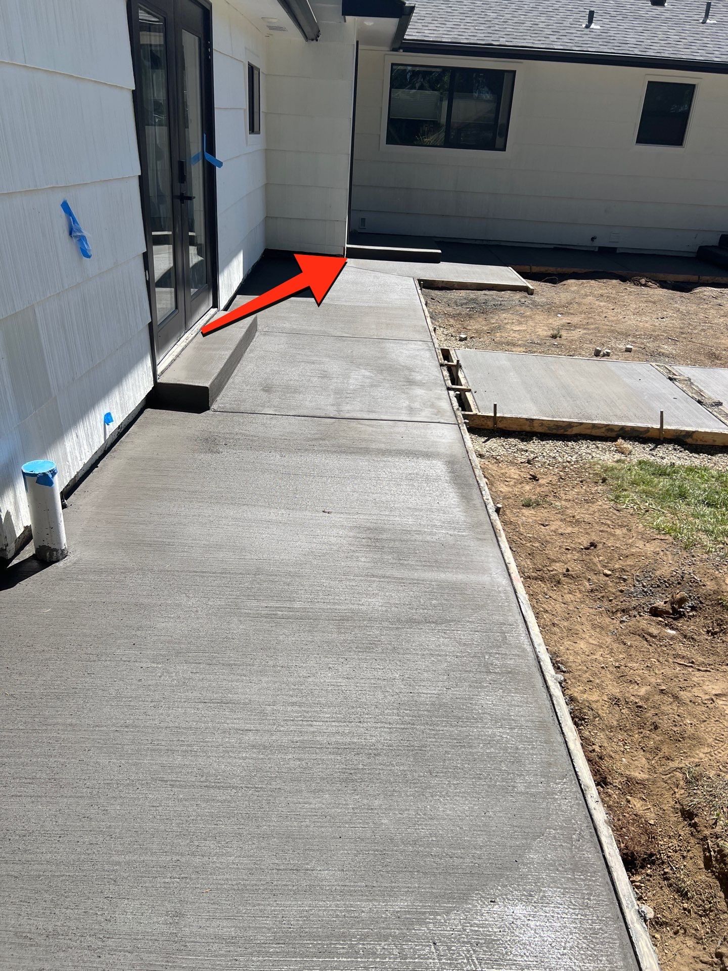 John | Concrete Backyard Walkway by Jireh Asphalt & Concrete Inc 