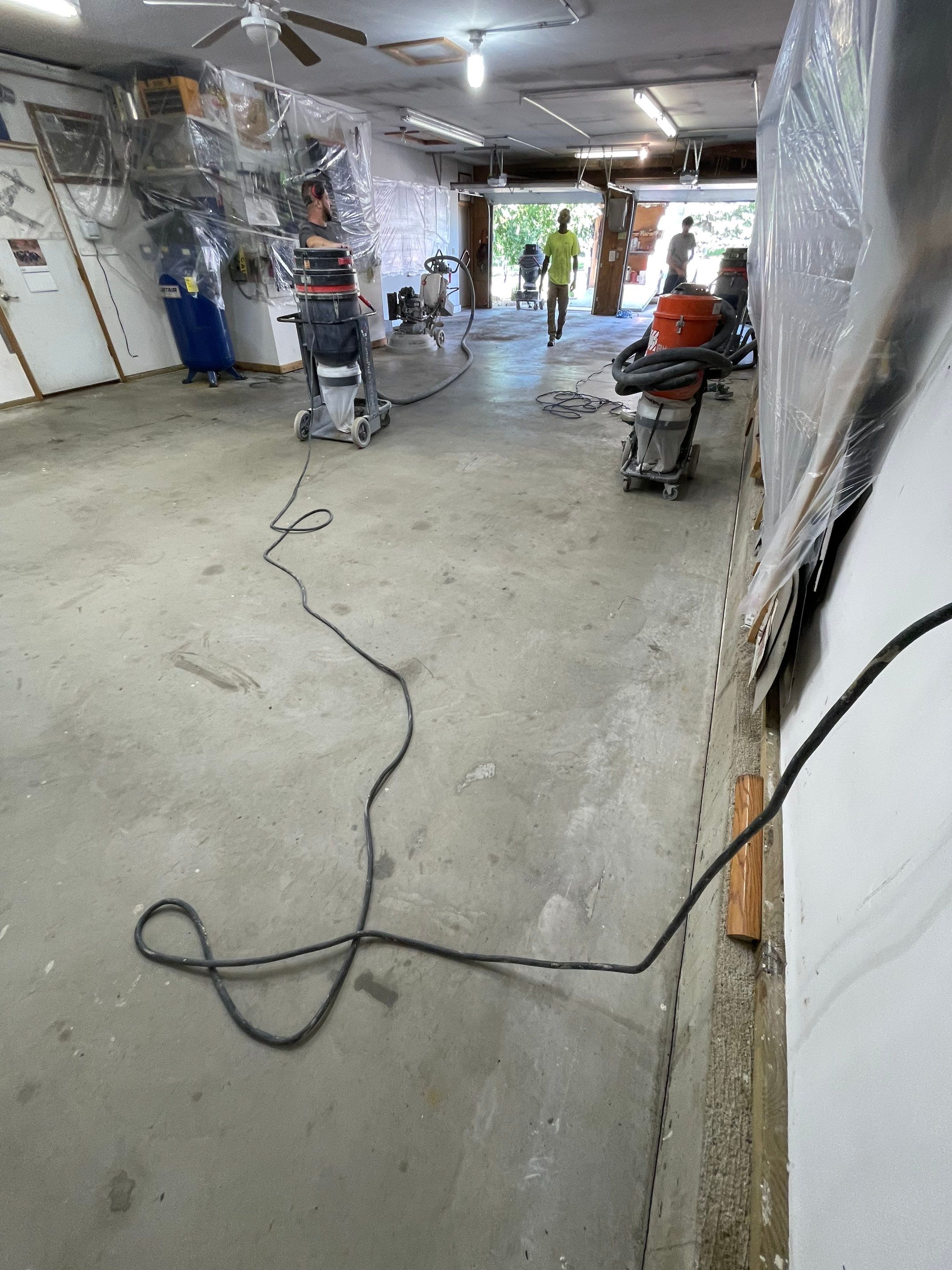 High-Performance Polyurea Garage Floor Coating and Stem Wall Finishing in Sioux Falls by Select Painting, Coatings & Garage Cabinets