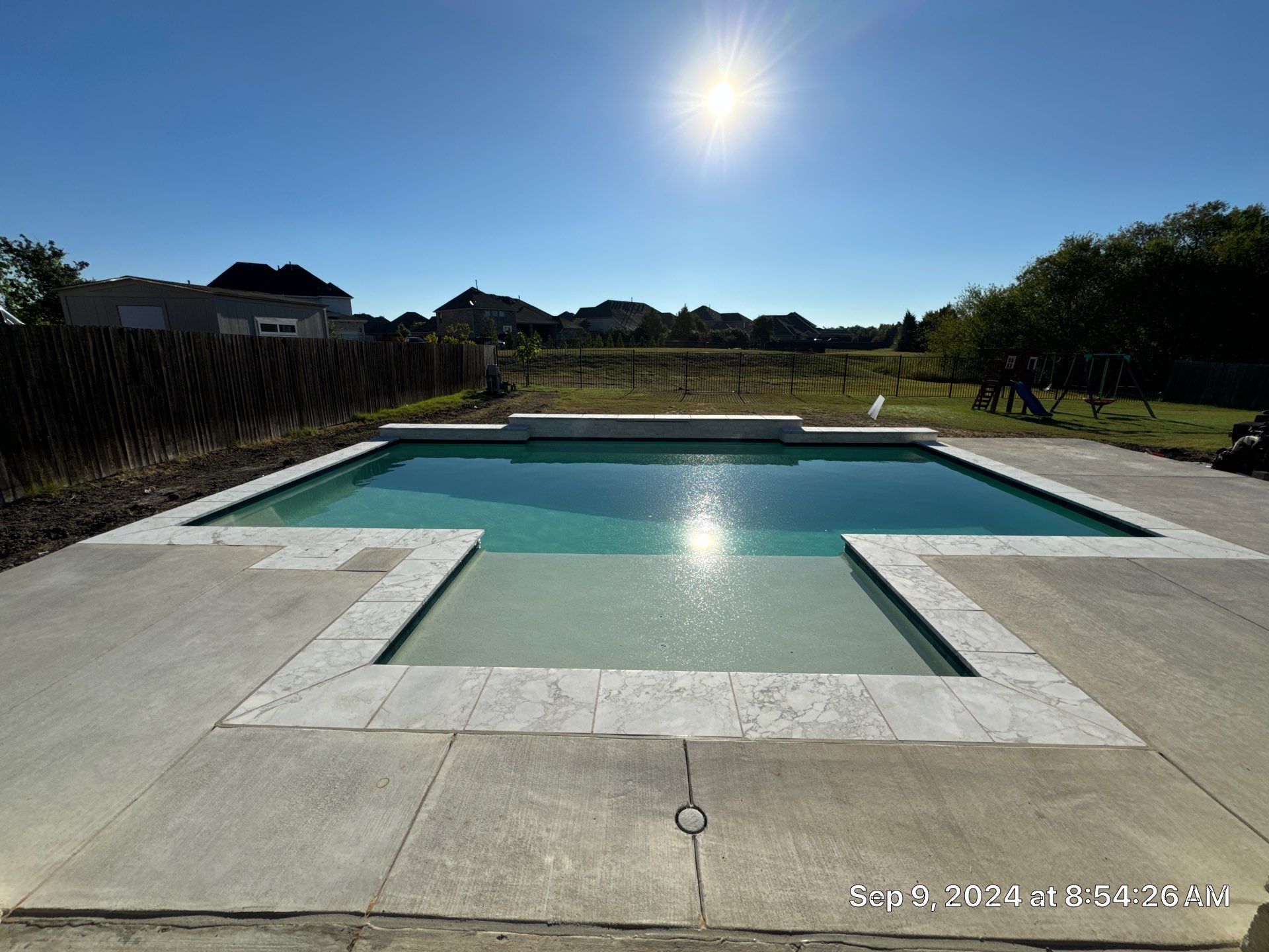 Crisp Geometric Pool with Sun Shelf by Pinnacle Pools and Spas - DFW