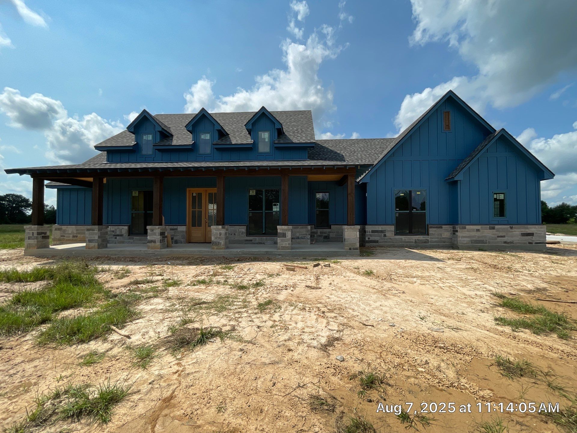 Natural Stone Elegance: Apex Installation Accented by Blue Siding by Apex Conventional Stucco Llc