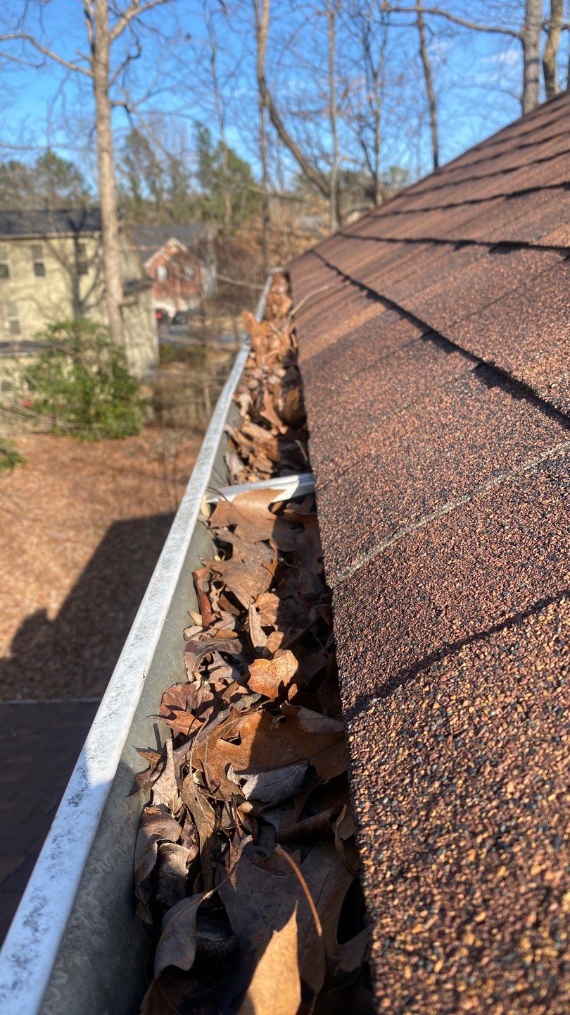 Cleaning Gutters  by Deerfield Roofing LLC