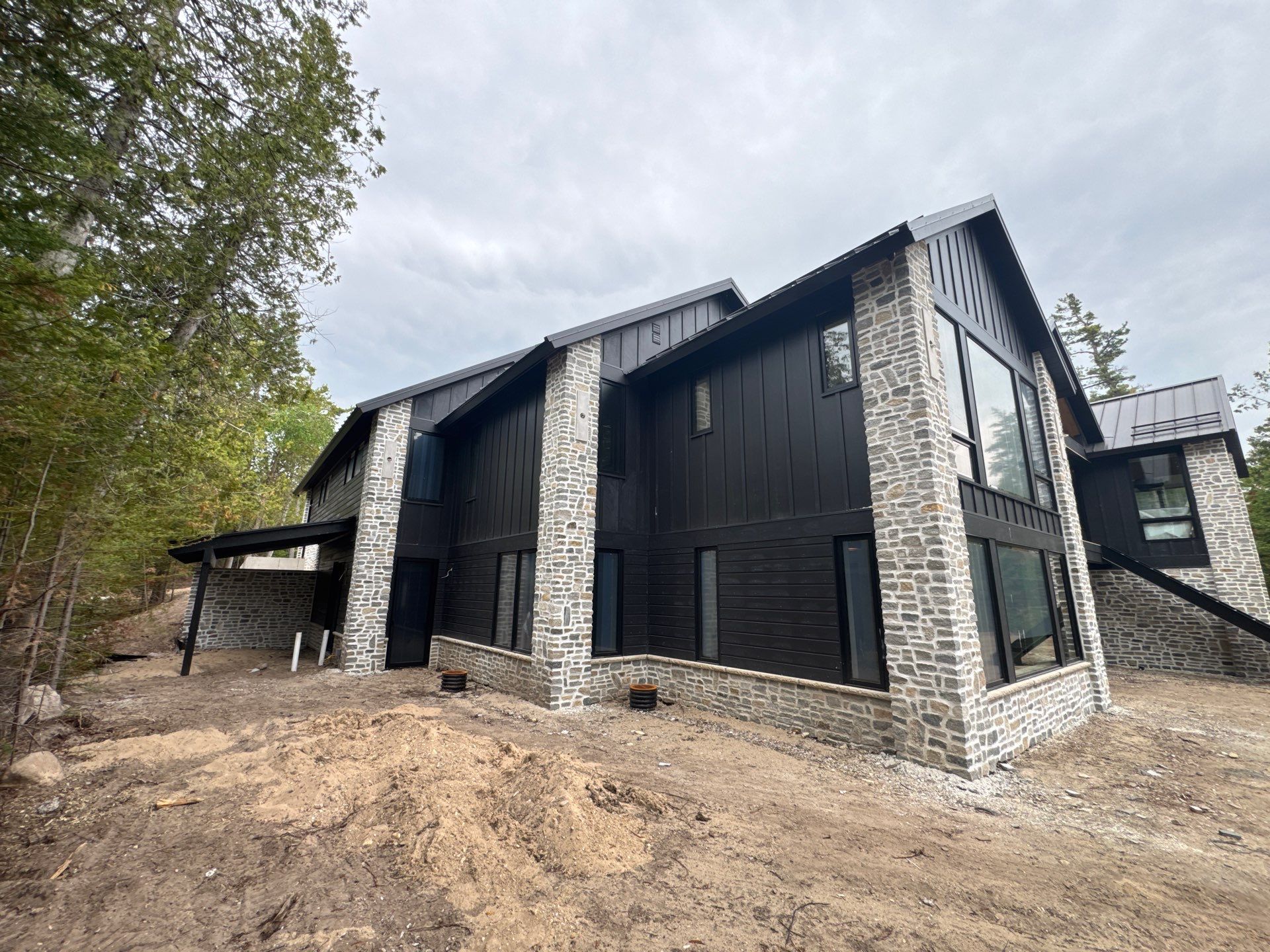 Gutter and Drainage System Installation for Modern Residential Build by Rainbow Seamless Systems
