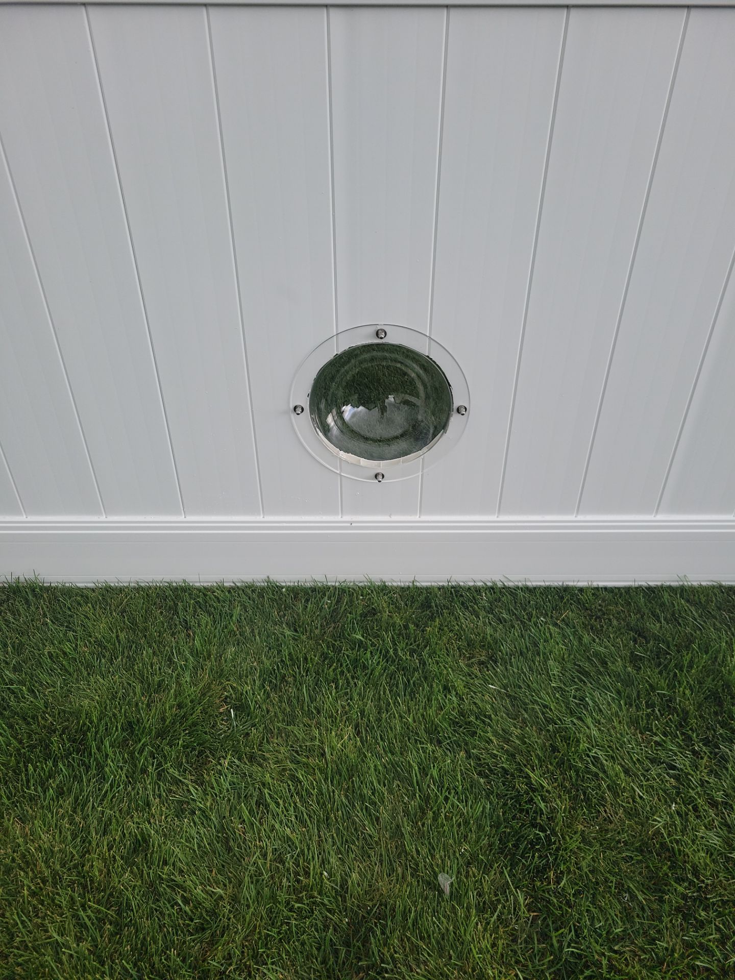 White Vinyl Privacy Fence With Pet Window in Cedar Falls by Perfect Picket Fence and Stain
