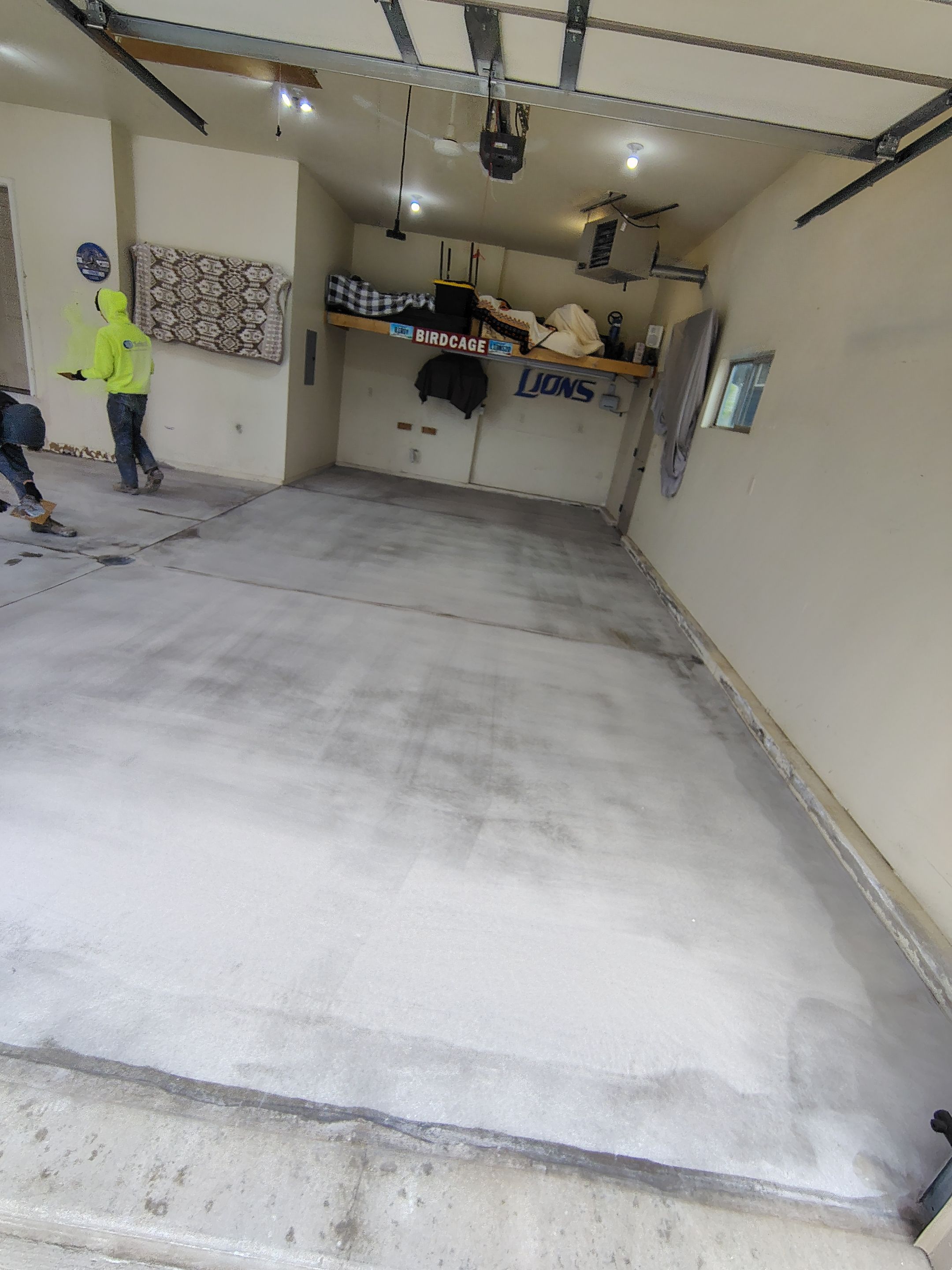 Sioux Falls Garage Floor Repair and Speckled Epoxy Coating Installation by Select Painting, Coatings & Garage Cabinets
