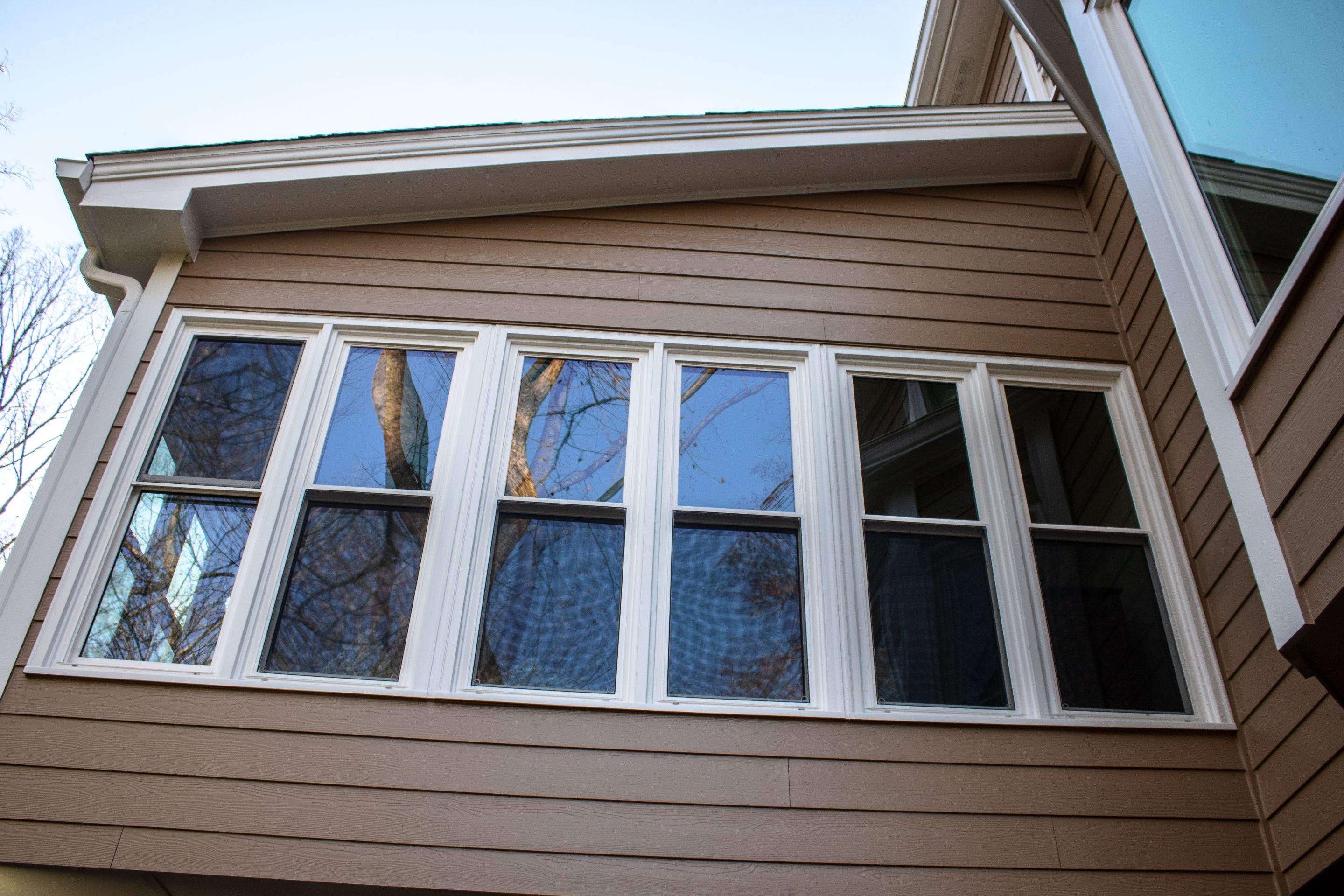 53 Window Replacements with Master 2800 Series Vinyl Replacement Windows and James Hardie Siding Installation by Nelson Exteriors 