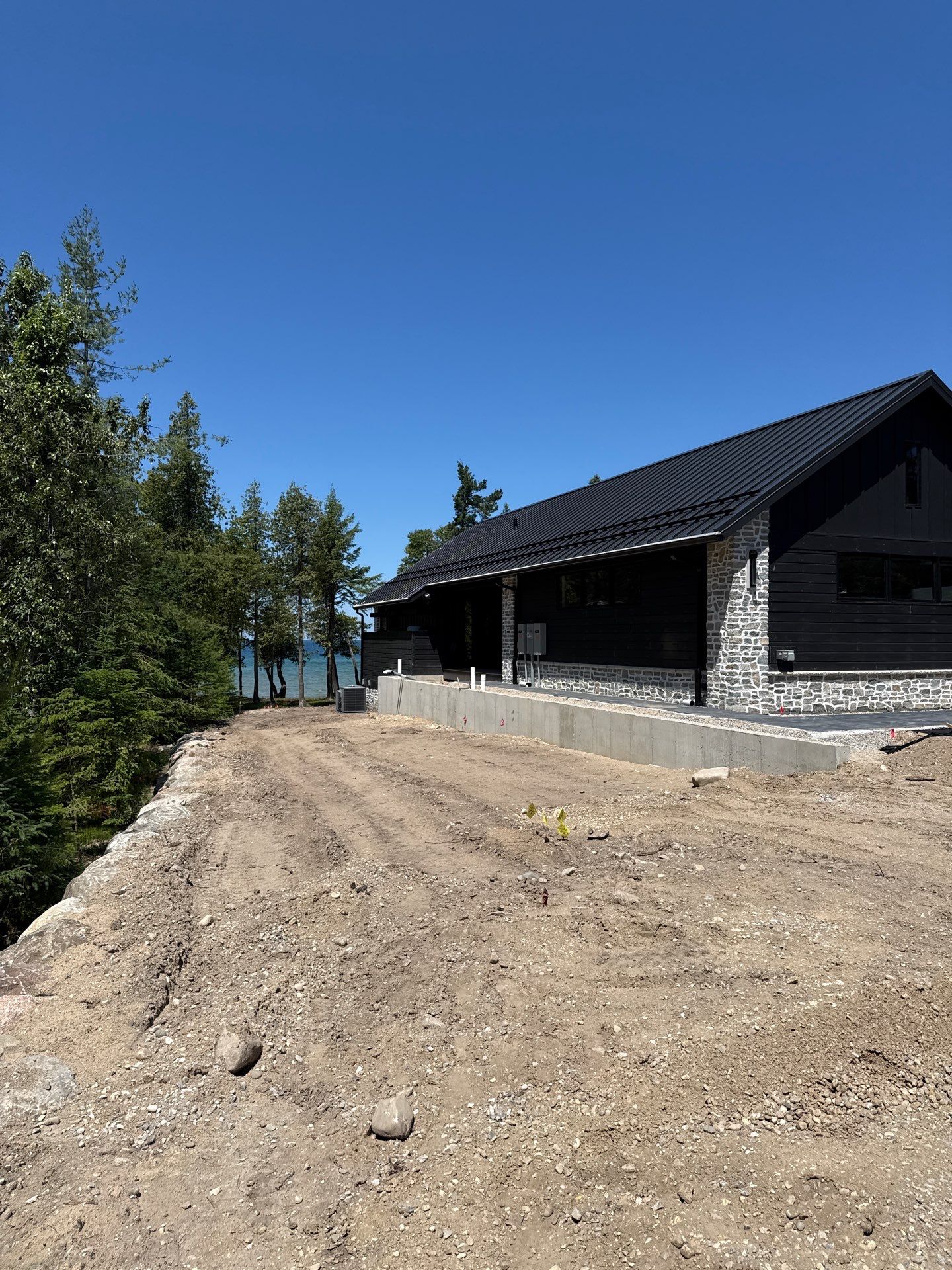 Gutter and Drainage System Installation for Modern Residential Build by Rainbow Seamless Systems
