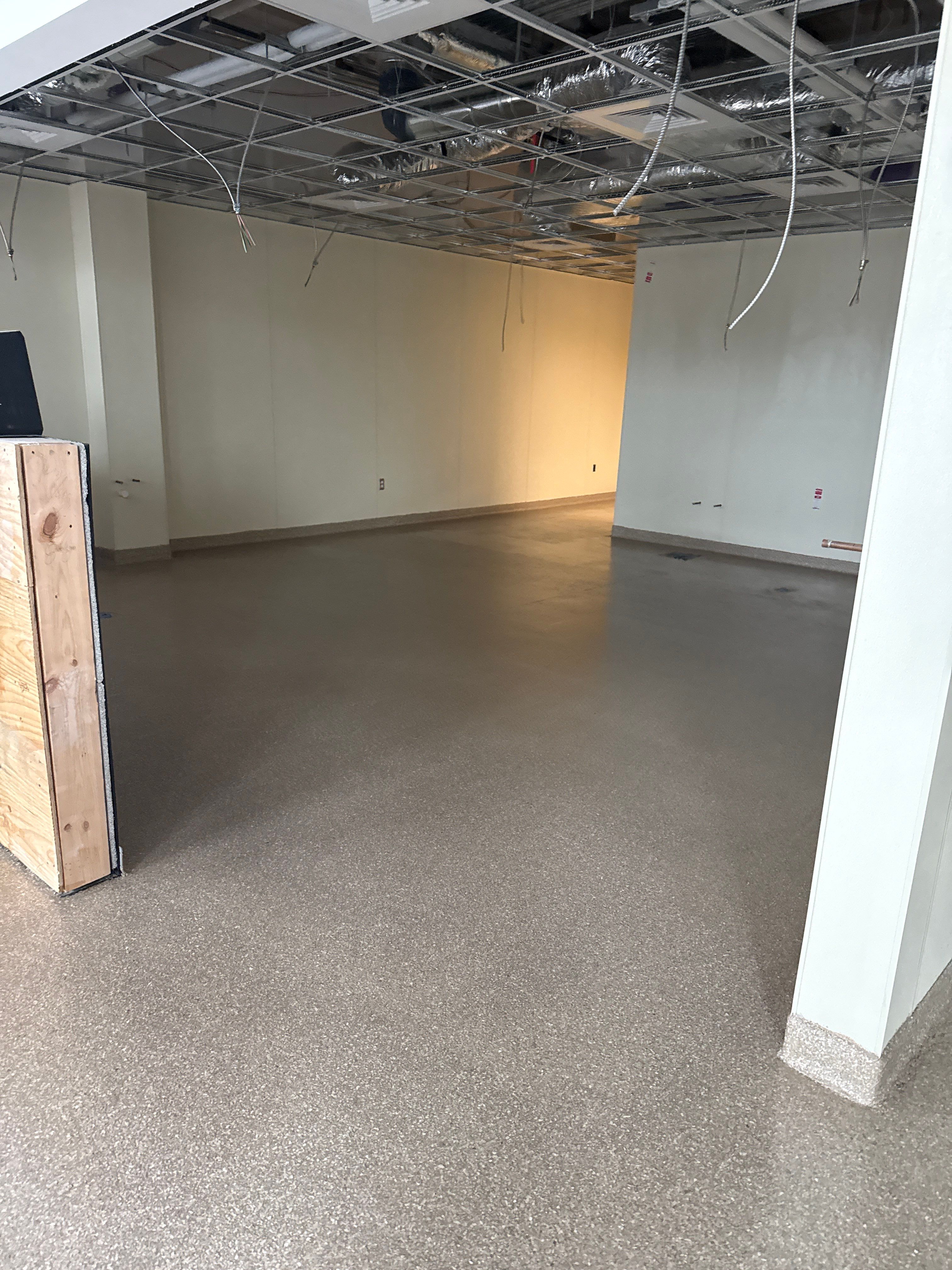 Industrial Epoxy Flake and Concrete Overlay Floor Installation in Pensacola by Cornerstone Hard Surface Restoration