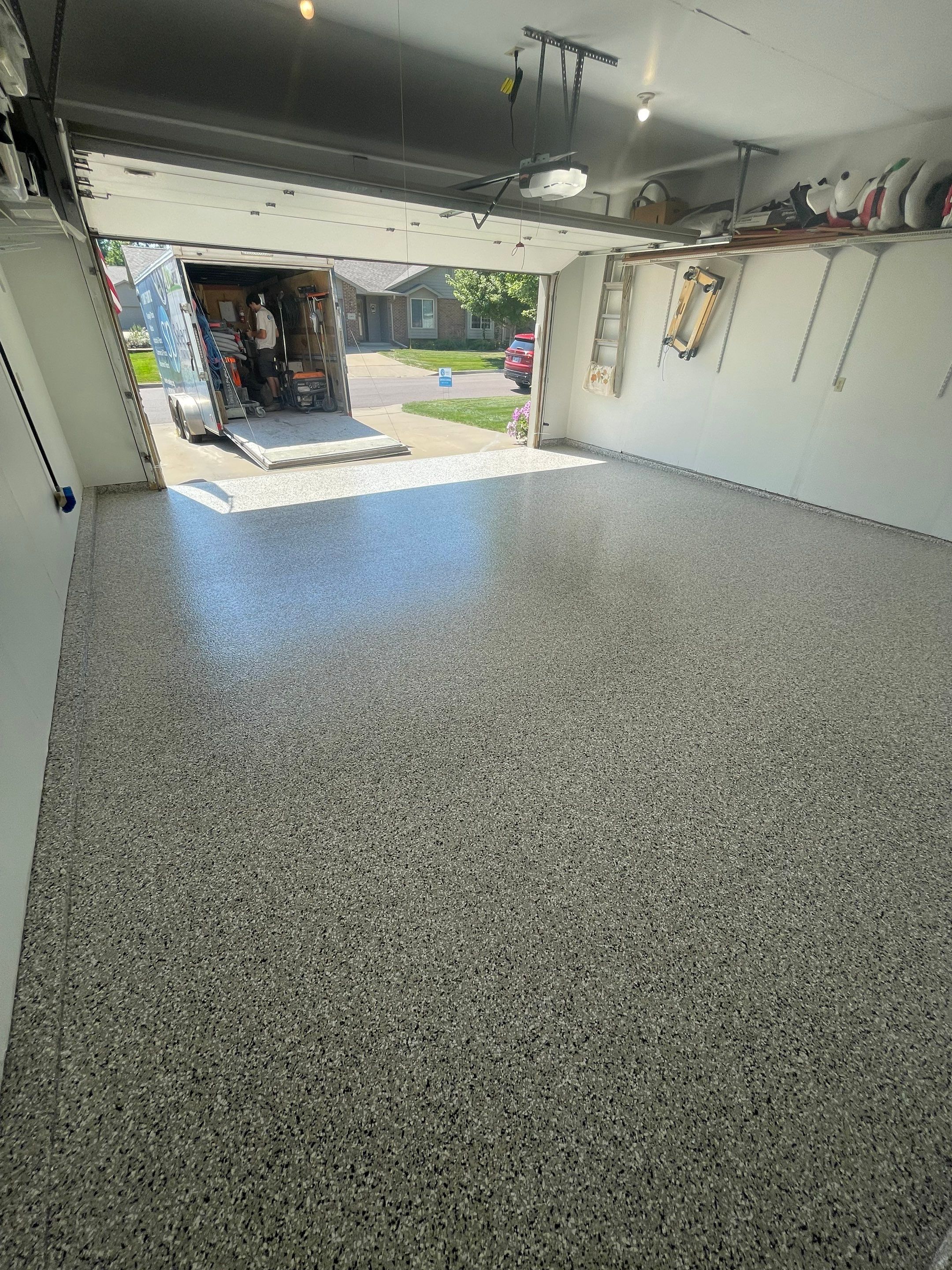 Sioux Falls Residential Garage Floor Coating with Speckled Epoxy Finish by Select Painting, Coatings & Garage Cabinets