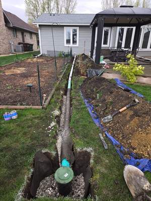 Repipe Tubing from Interior Sump Pump to Exterior Discharge Point