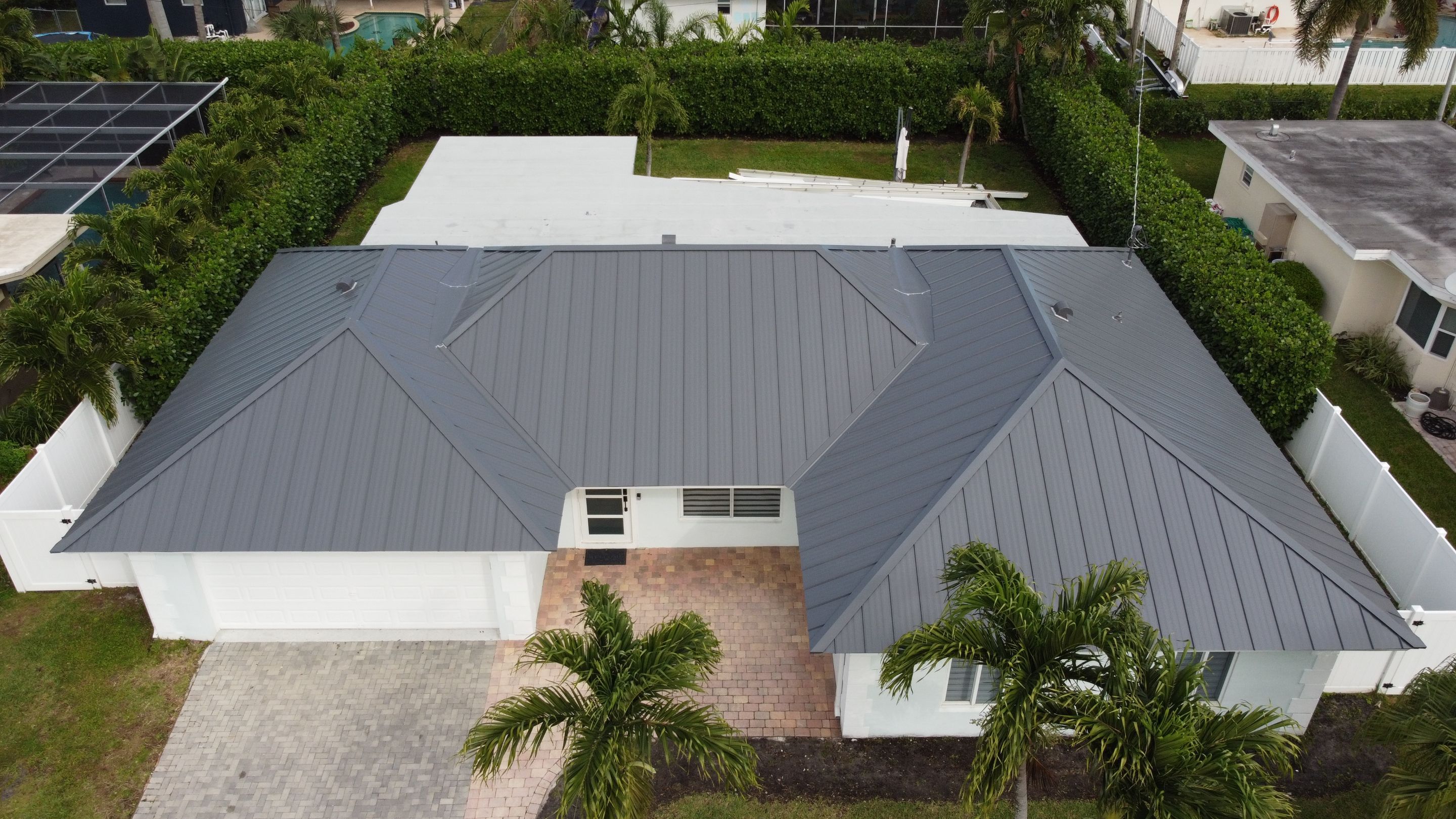 Residential Roofing Installation using 1" Nail strip metal roof by BLUES BROTHERS CONSTRUCTION CORP
