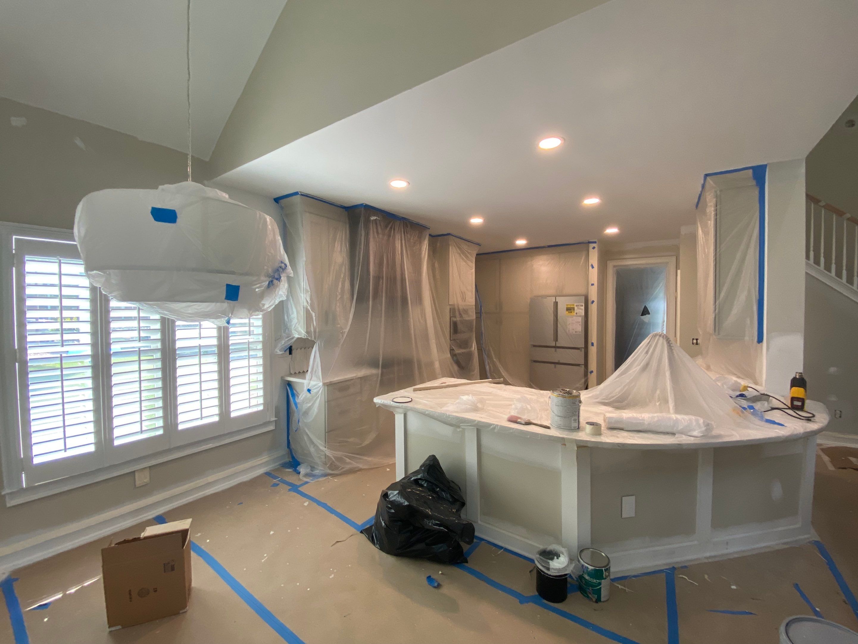 Modern Kitchen Remodeling with Quartz Island and Custom Vent Hood in Woodstock by Swift Home Renovations