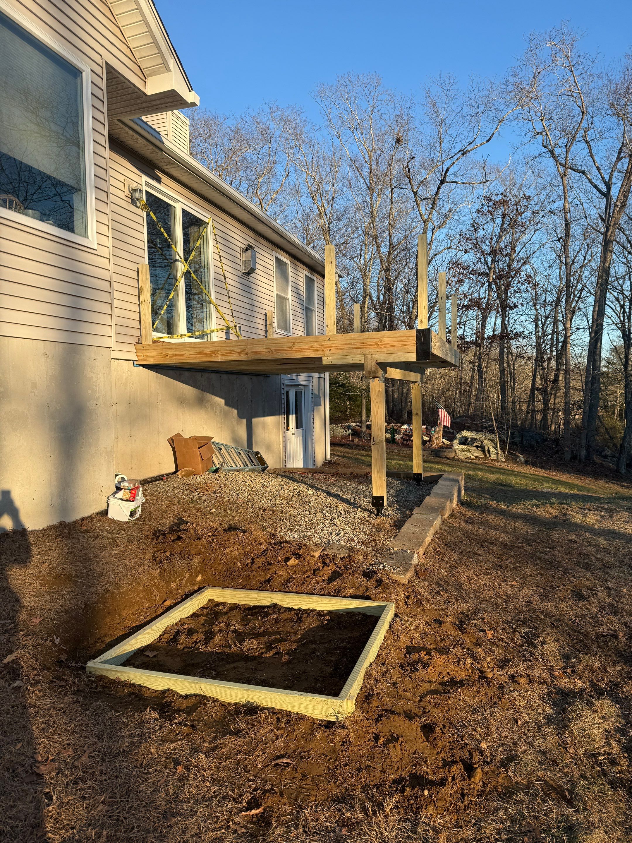 Replacement deck using Trex Transcend Ropeswing and White Transcend railings, with gate by DiGiorgi Roofing and Siding Inc