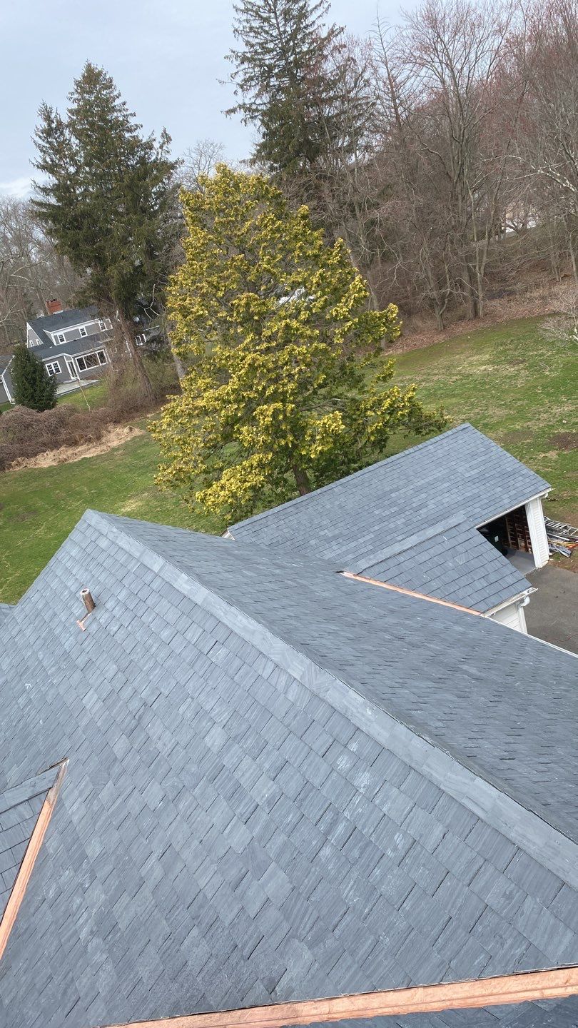 Residential Roofing Installation using Vermont Slate by A Plus Exterior