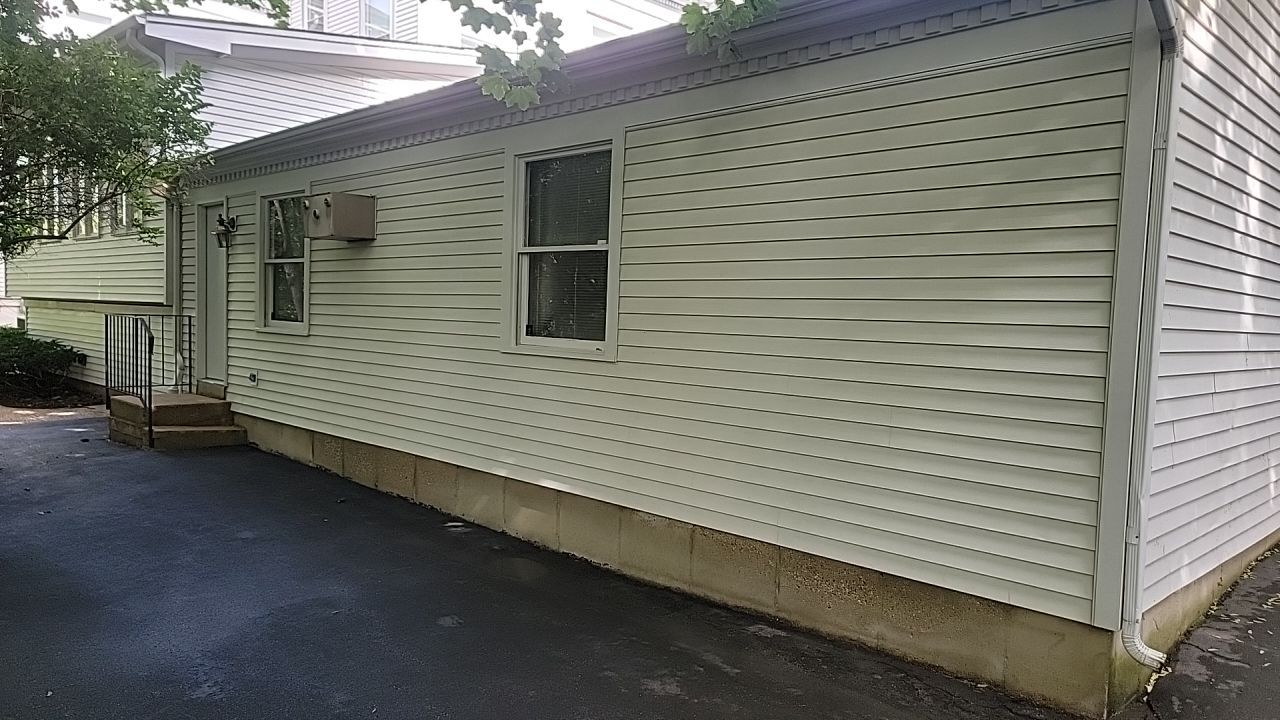 Housewashing  using Algaecide, soft wash soap by Northern Power Washing LLC.