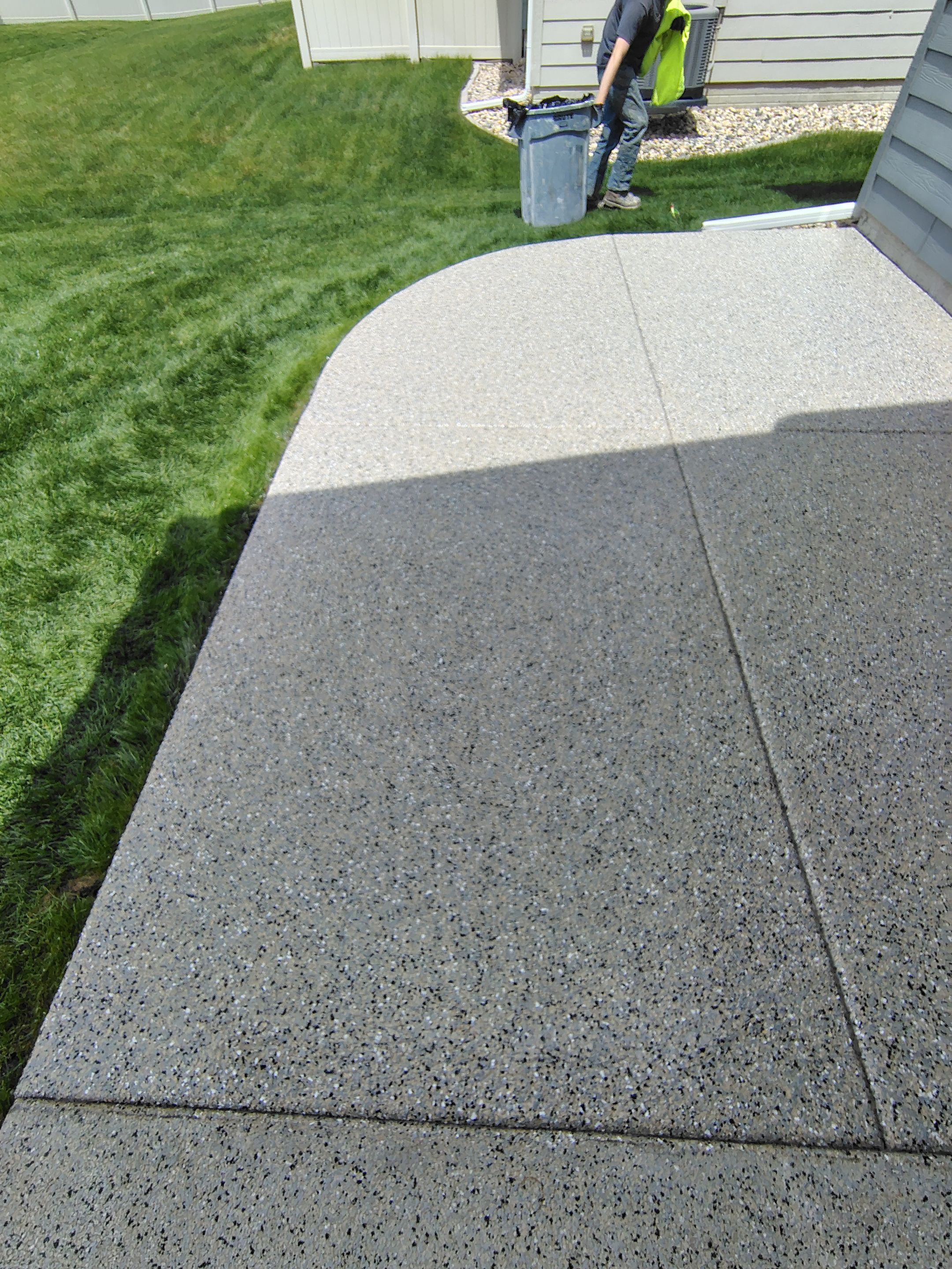 Speckled Concrete Patio Coating Installation in Sioux Falls by Select Painting, Coatings & Garage Cabinets