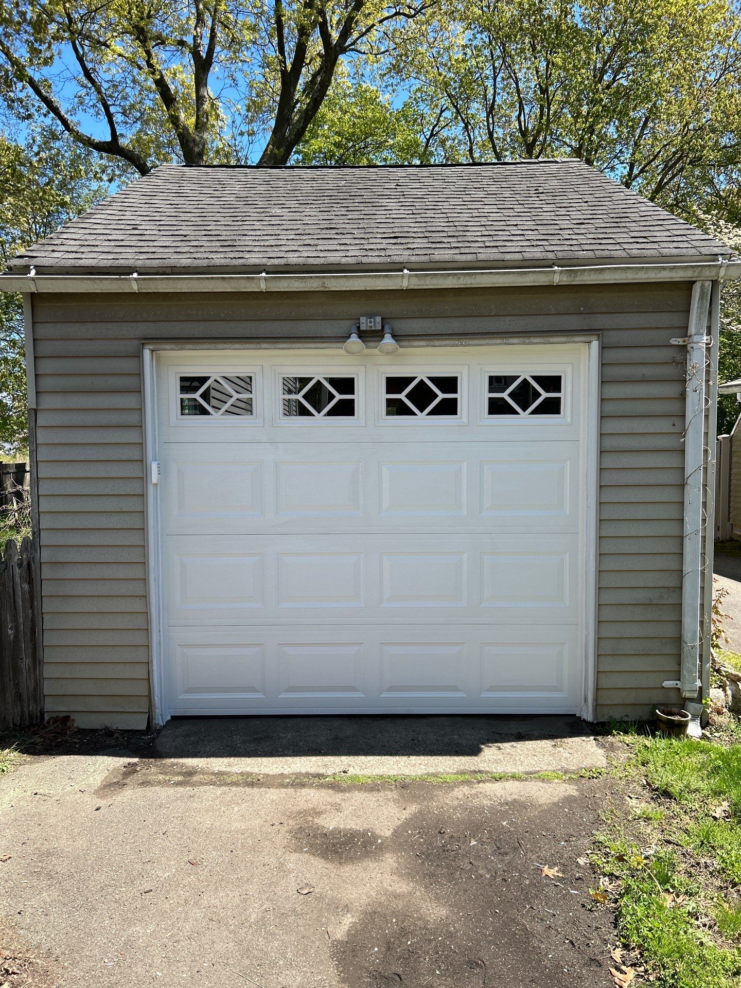 Garage Door Upgrade with Decorative Window Inserts by DiGiorgi Roofing and Siding Inc