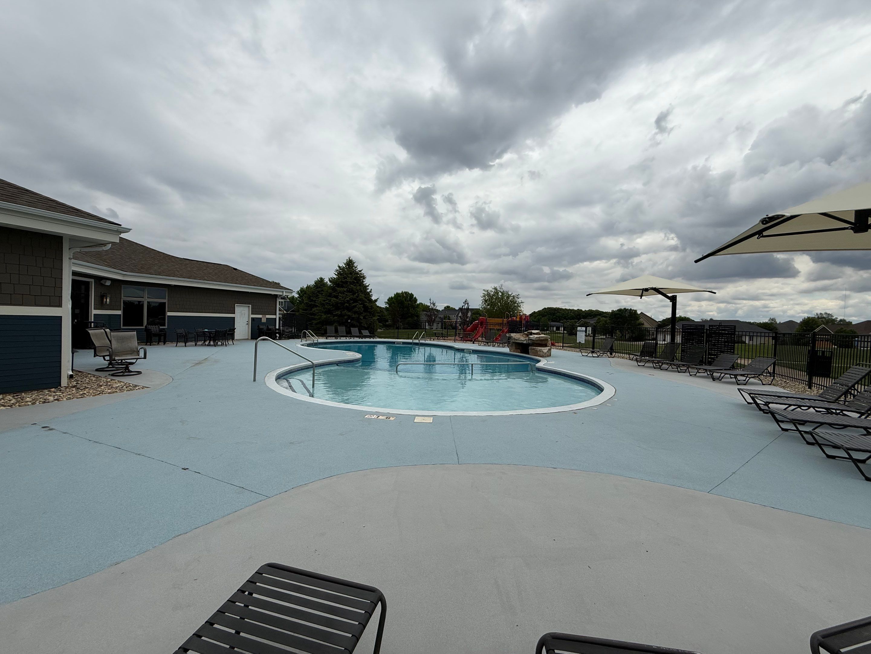 Arbors Edge Pool Deck Restoration and Textured Concrete Coating by Select Painting, Coatings & Garage Cabinets