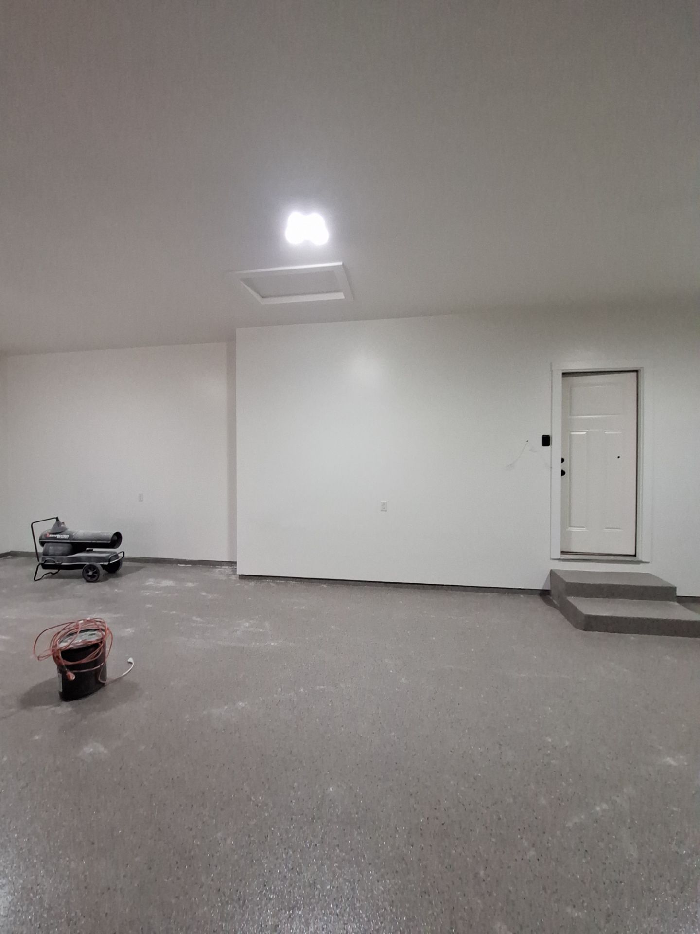 Hudsonville Garage Renovation Featuring Finished Drywall and Flake Epoxy Floors by Gordon Painting