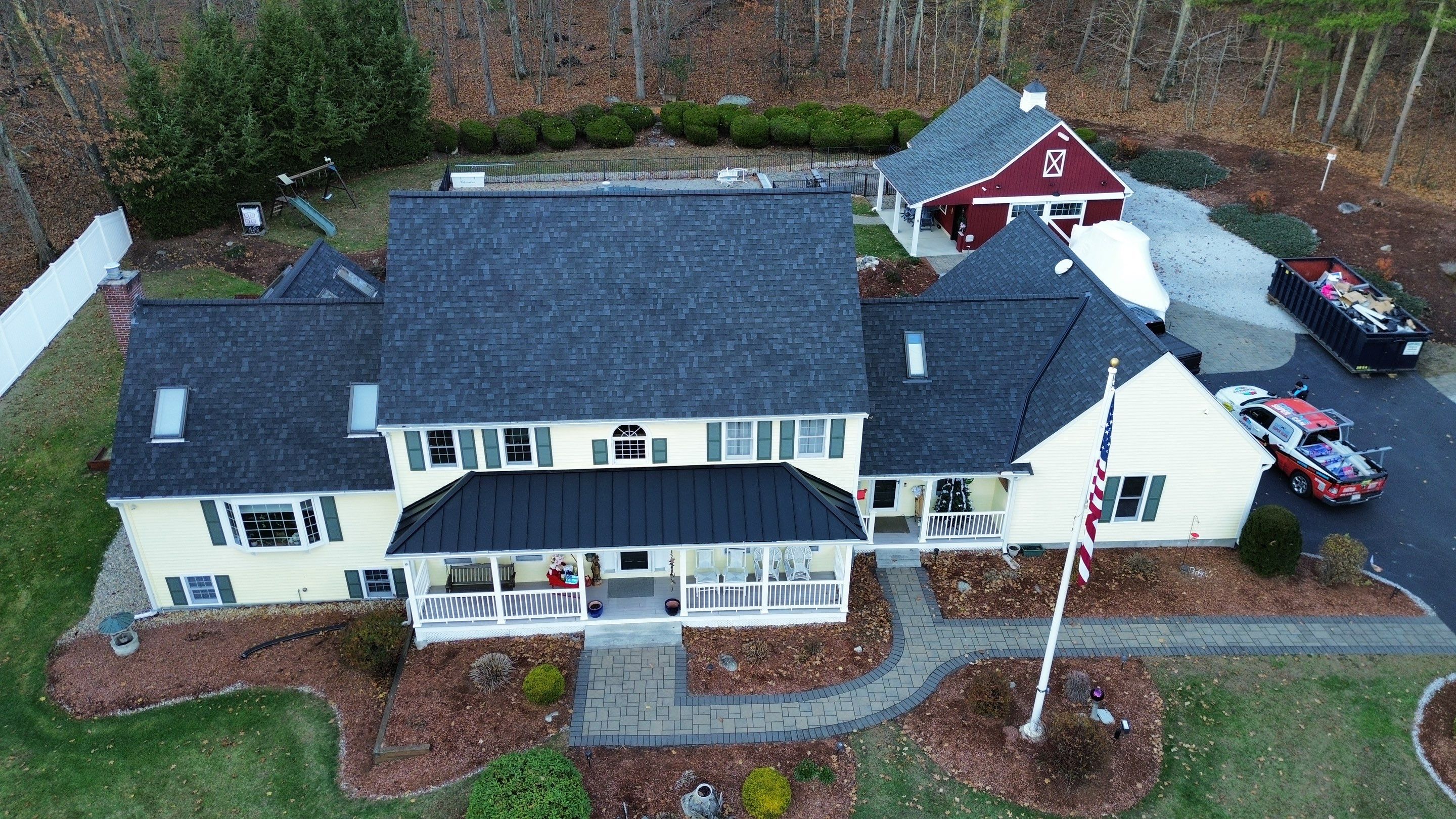 Chelmsford Premium Roof: Onyx Black Shingles with Standing Seam Metal Porch by Mighty Dog Roofing of Greater Middlesex County