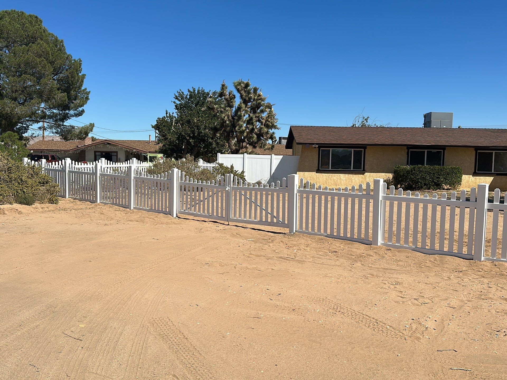 White picket fence  by Fence Guys Inc. 