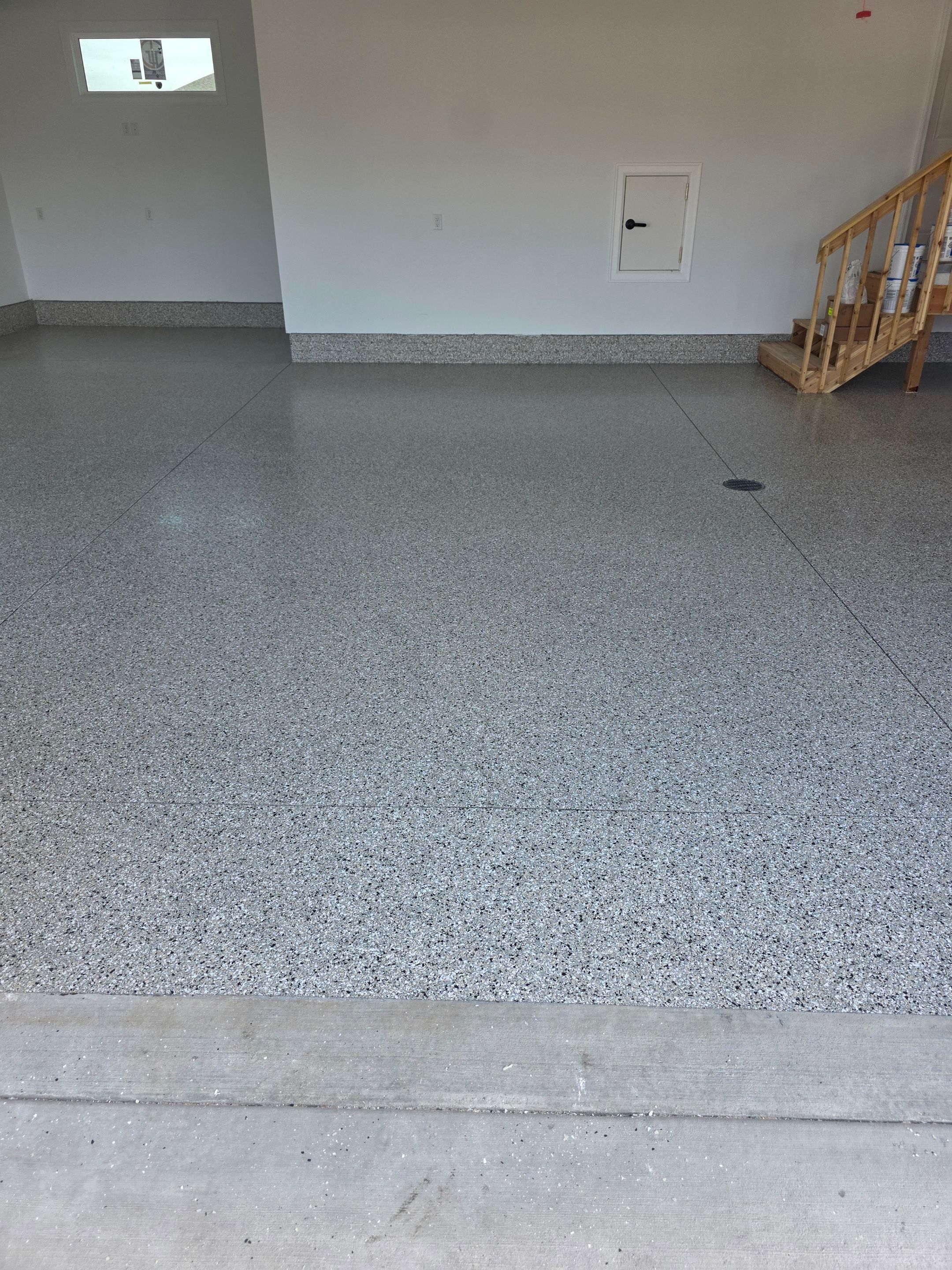 Gray and Black Speckled Polyurea Garage Floor in Dell Rapids by Select Painting, Coatings & Garage Cabinets