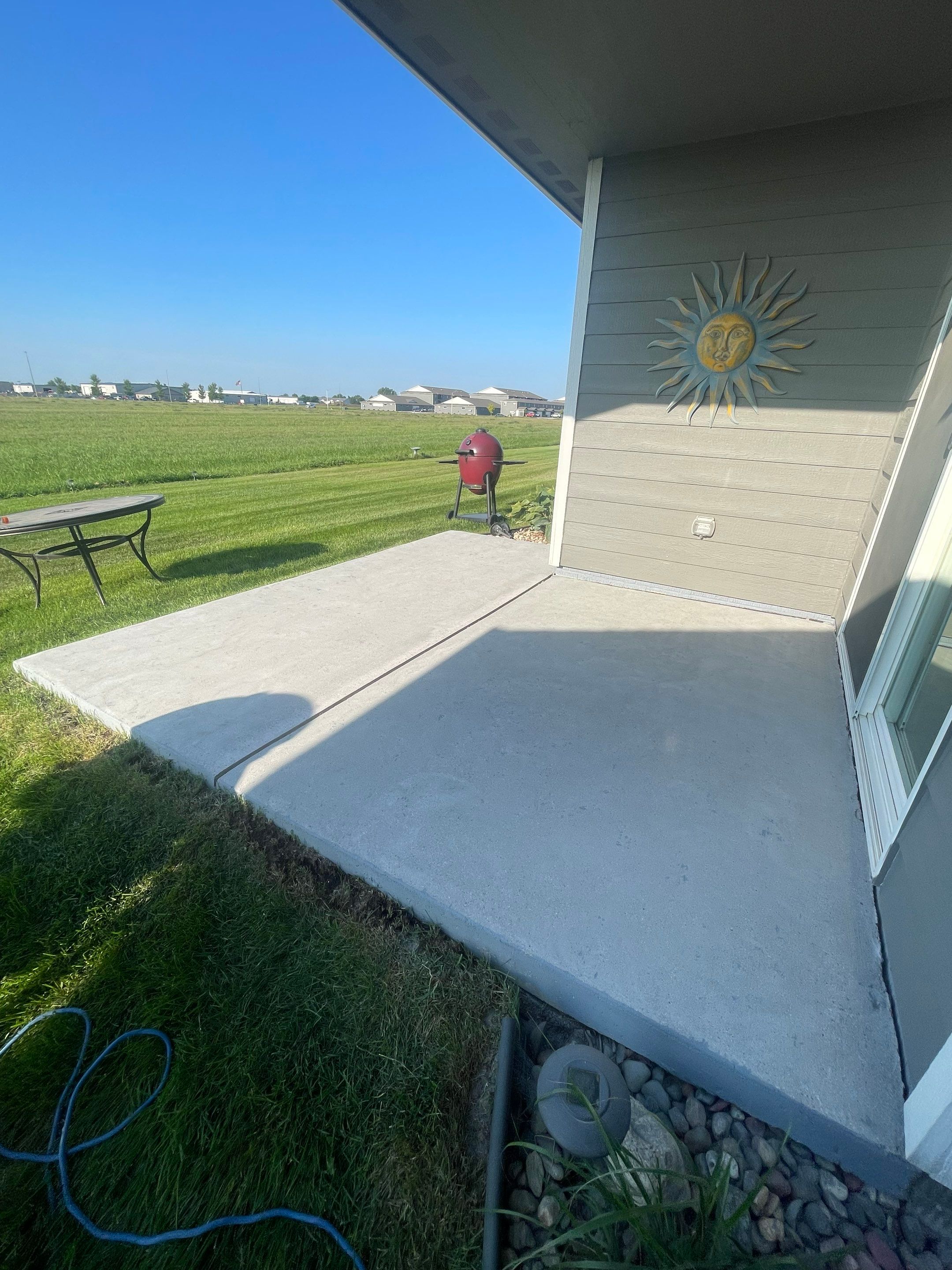 Starry Evening Concrete Patio Coating Installation in Tea by Select Painting, Coatings & Garage Cabinets