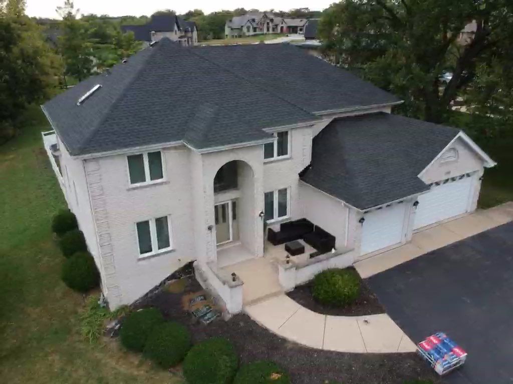 Roof and windows by Optimal Home Improvement 