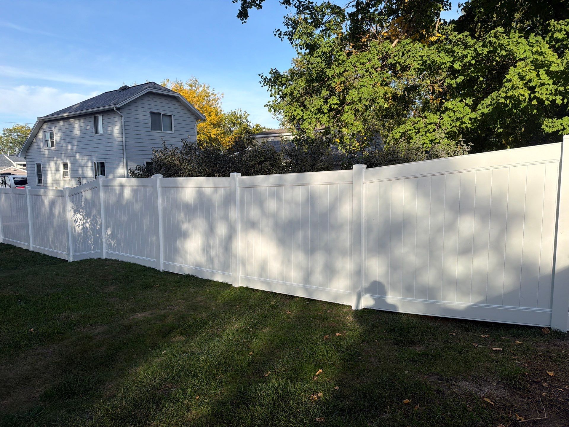 White Vinyl Privacy Fence and Gate Installation in Grundy Center by Perfect Picket Fence and Stain