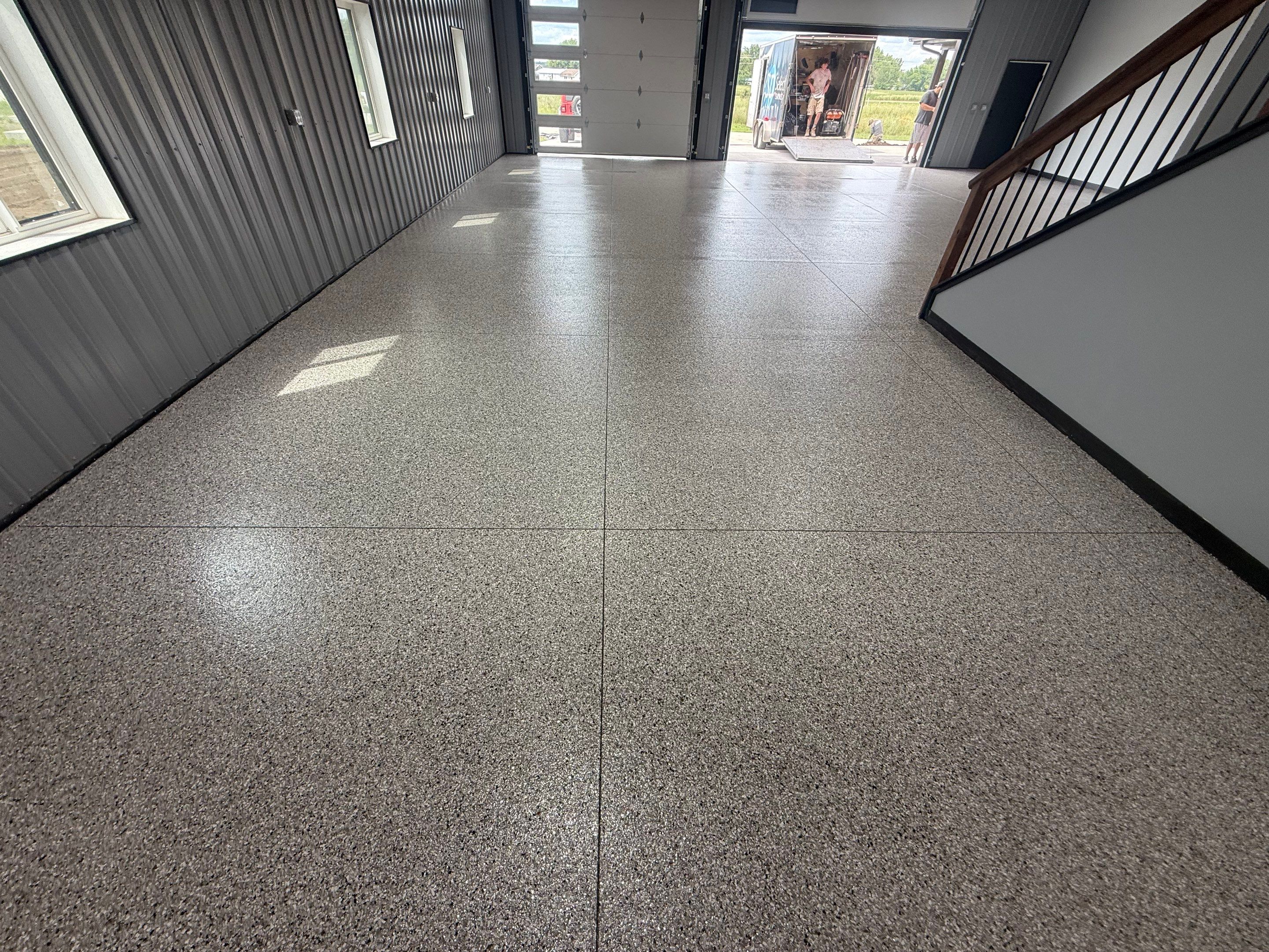 Polyaspartic Garage Floor Coating with Decorative Flake in Wentworth by Select Painting, Coatings & Garage Cabinets