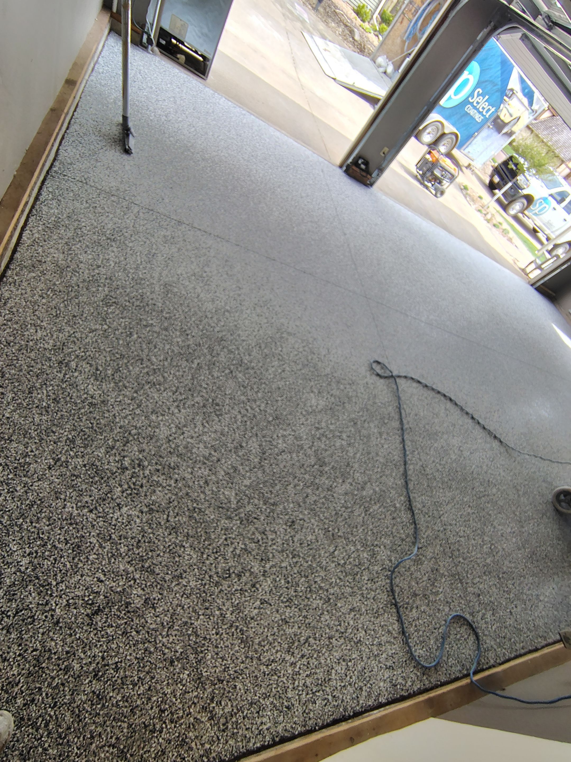 Garage Floor Concrete Coating and Crack Repair in Sioux Falls by Select Painting, Coatings & Garage Cabinets