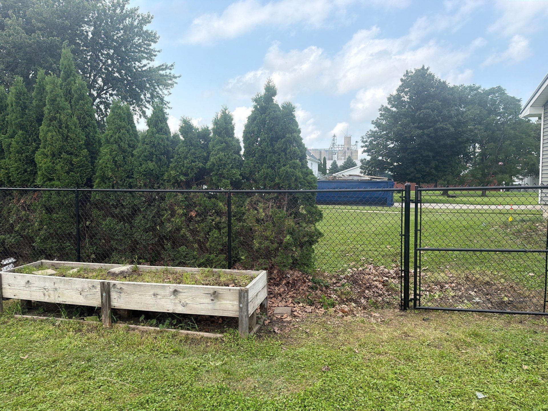 Residential Black Chain Link Fence Installation in Reinbeck by Perfect Picket Fence and Stain