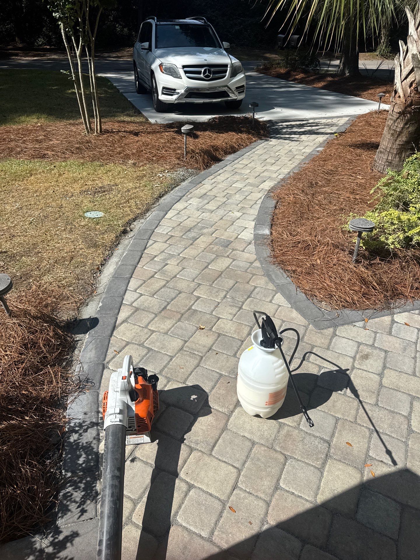 Custom Concrete Patio and Herringbone Paver Walkway in Hilton Head Island by Lowcountry Scapes, LLC
