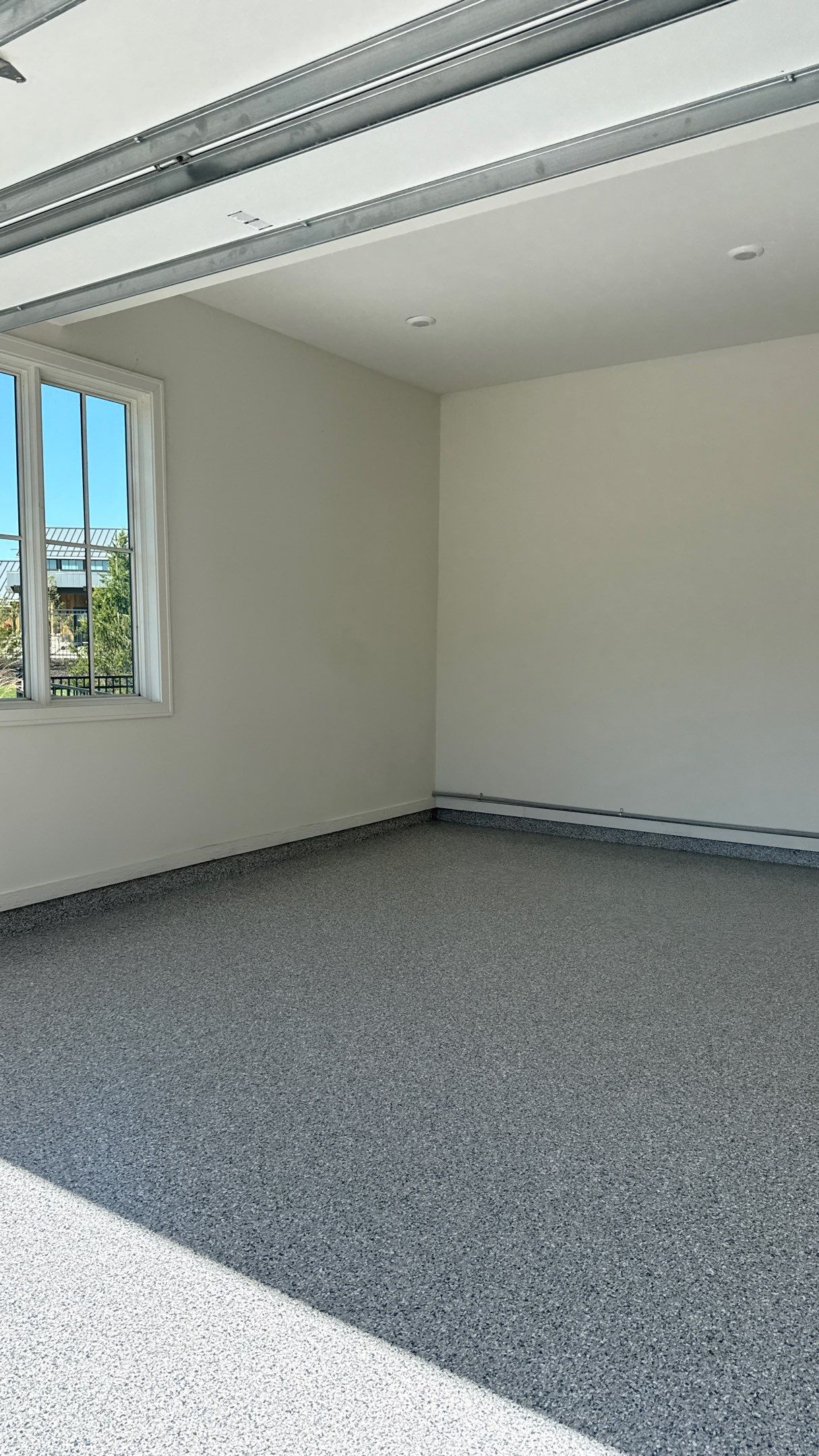 Garage Remodel with Custom Cabinets and Epoxy Floors in Overland Park by Banner Garage