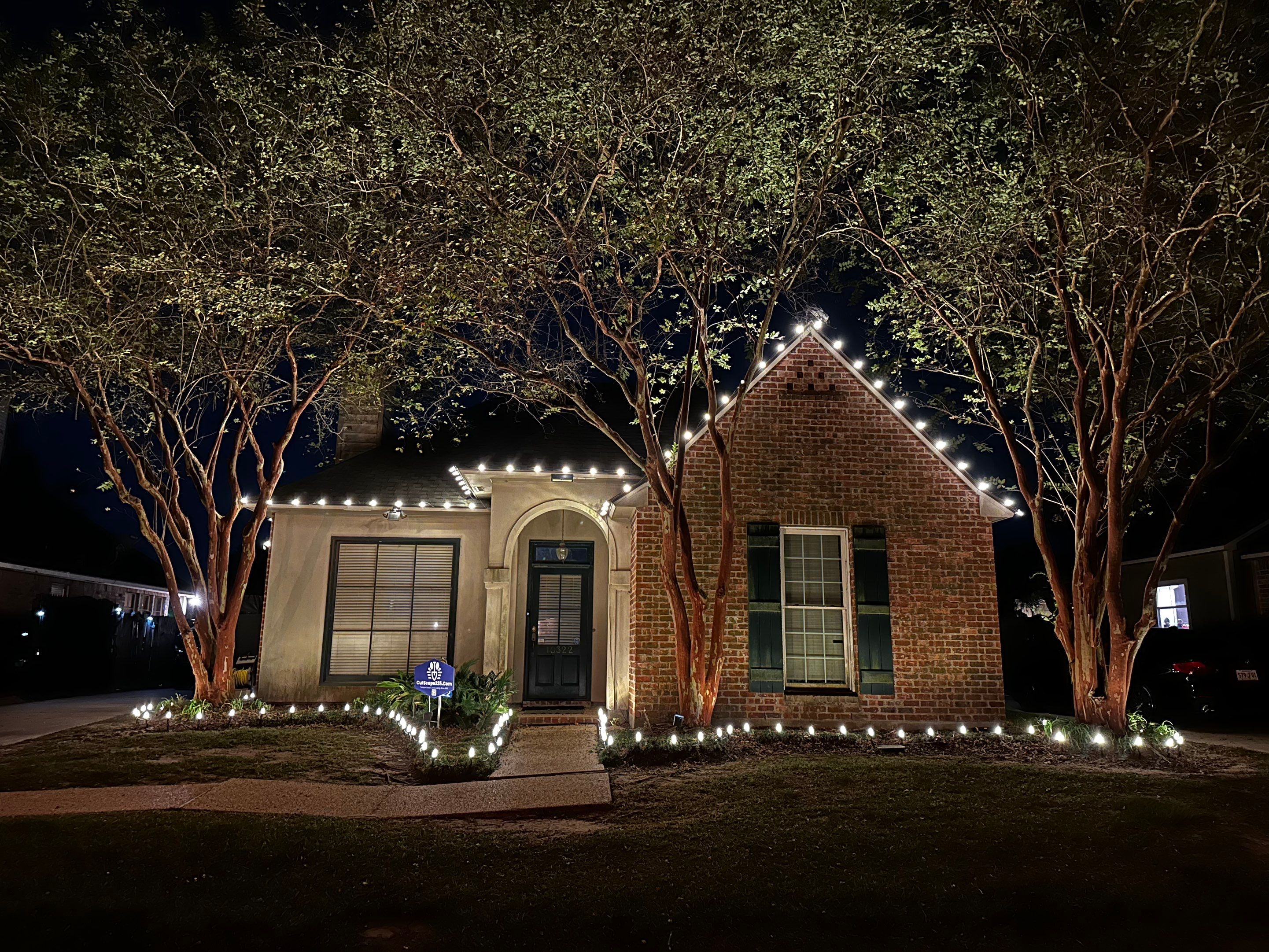 WINTER SERVICES: HOLIDAY LIGHTING using ROOFLINE PERIMETER LIGHTING: HALLOWEEN THEME WITH ORANGE AND PURPLE BULBS by CutScape, LLC.