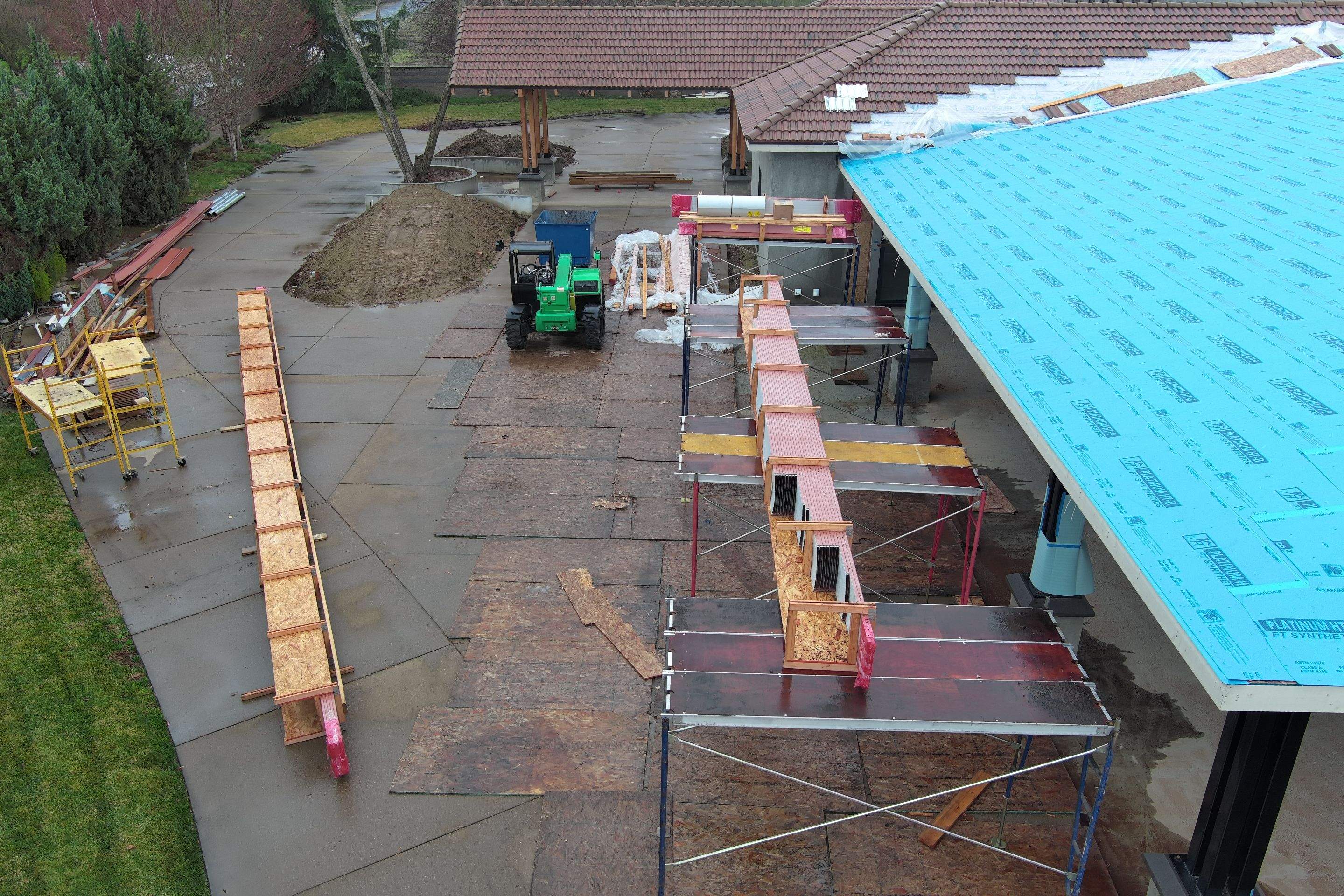 Tile, Metal, and TPO roofing project (new construction) by Straight Edge Roofing Inc