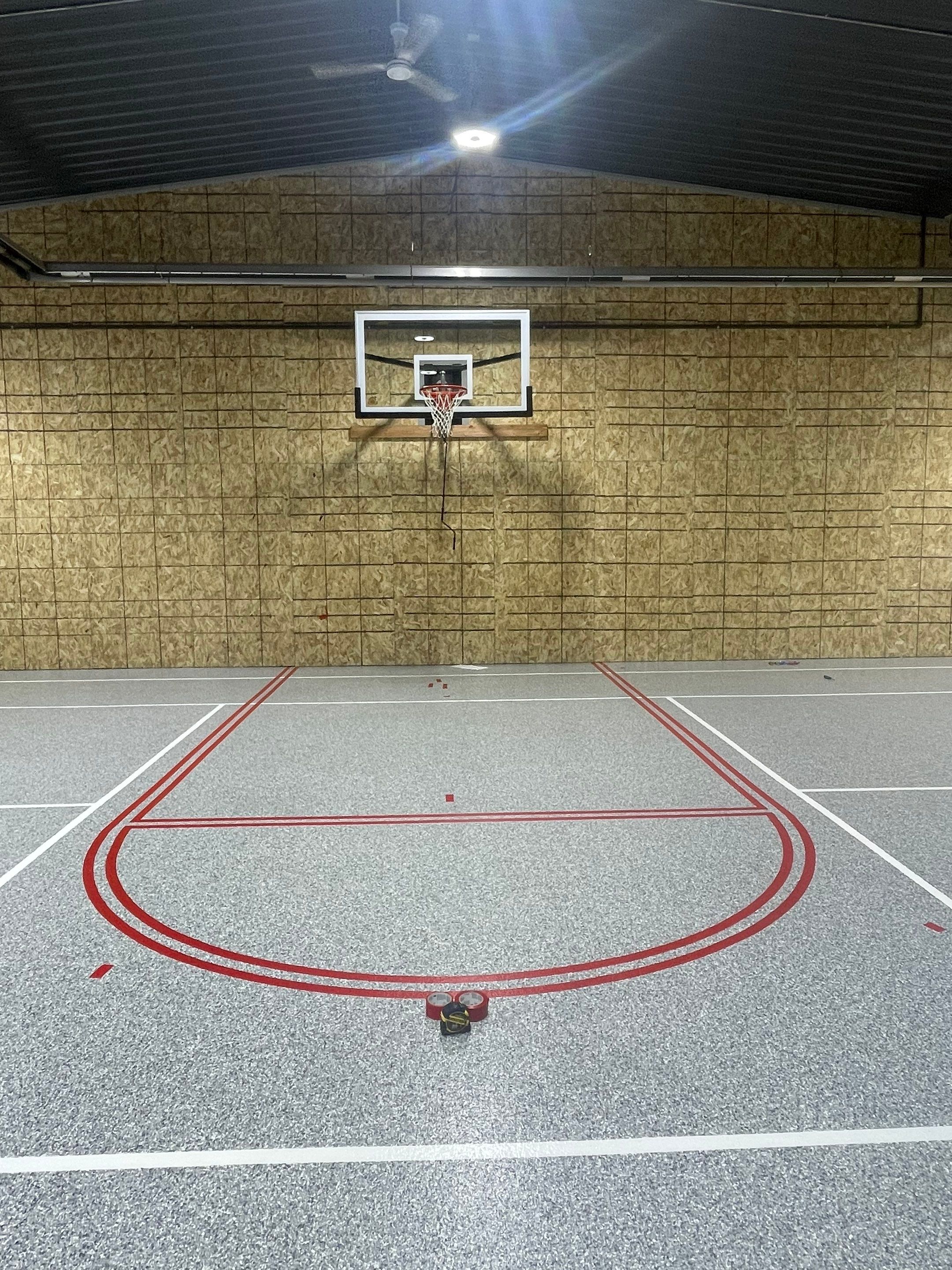 Custom Polyurea Shop Floor with Basketball Court Lines in Rock Valley by Select Painting, Coatings & Garage Cabinets