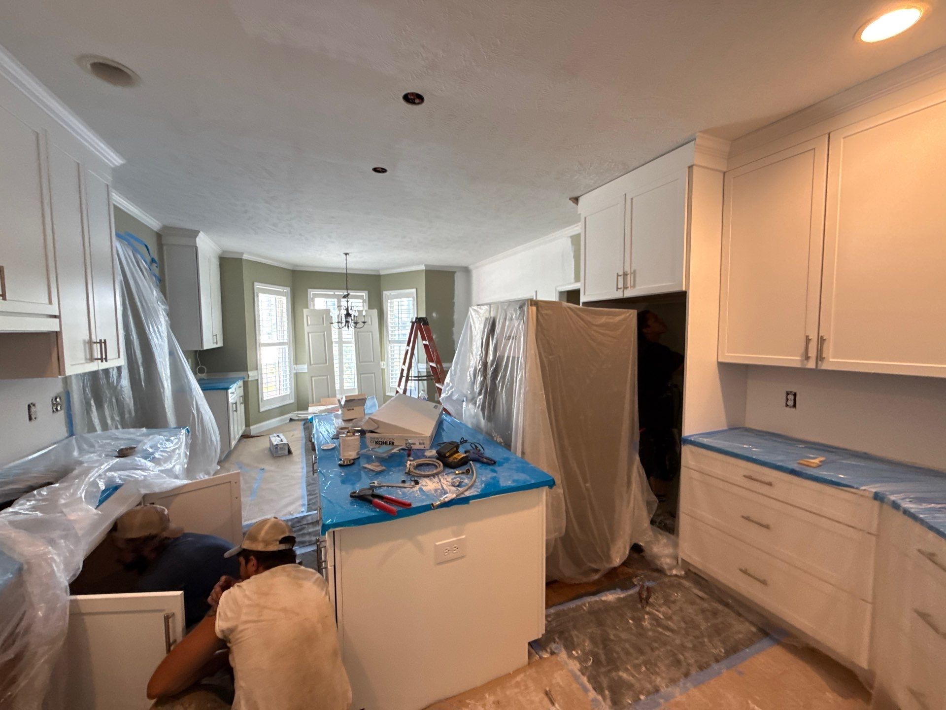 Complete Kitchen Renovation Featuring White Shaker Cabinetry in Fayetteville by Karcher Roofing & Construction